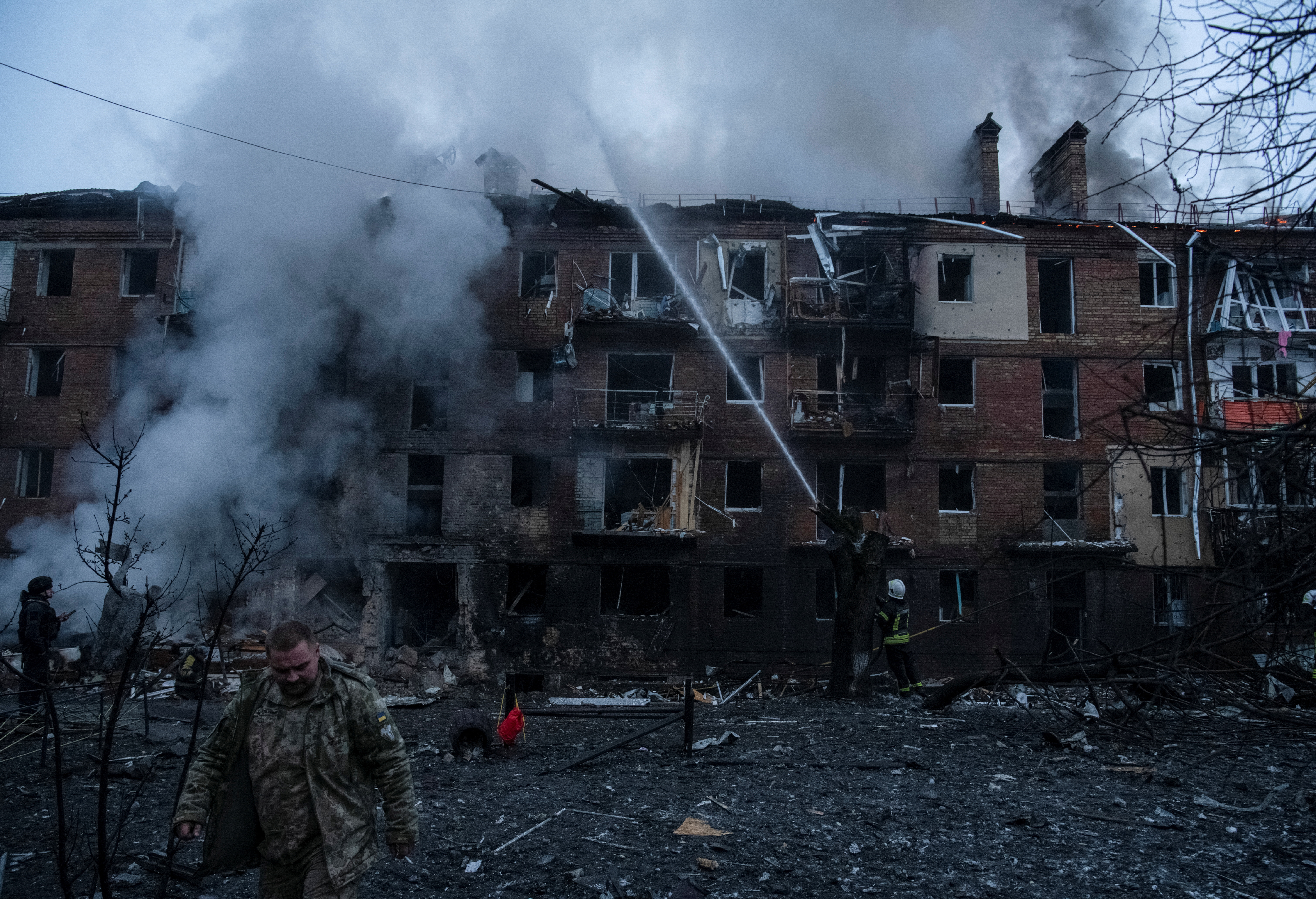 Rescuers work at a site of a residential building destroyed by a Russian missile attack in Vyshhorod