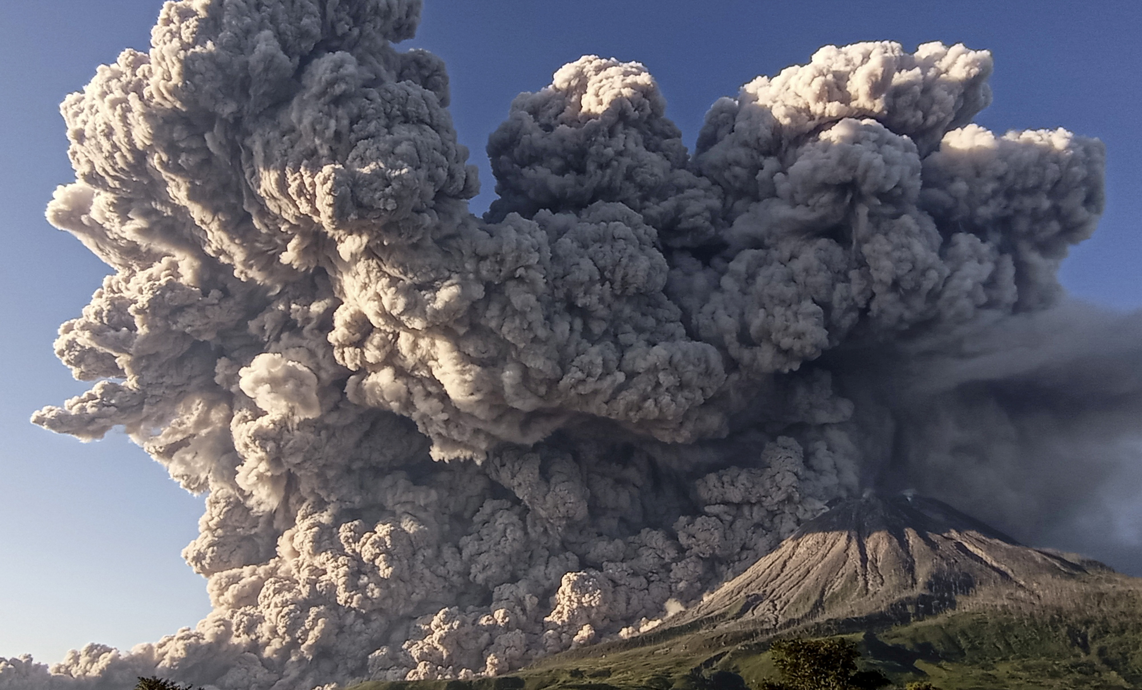 Indonesia’s Mount Sinabung Volcano Spews Ash Into Sky | Reuters