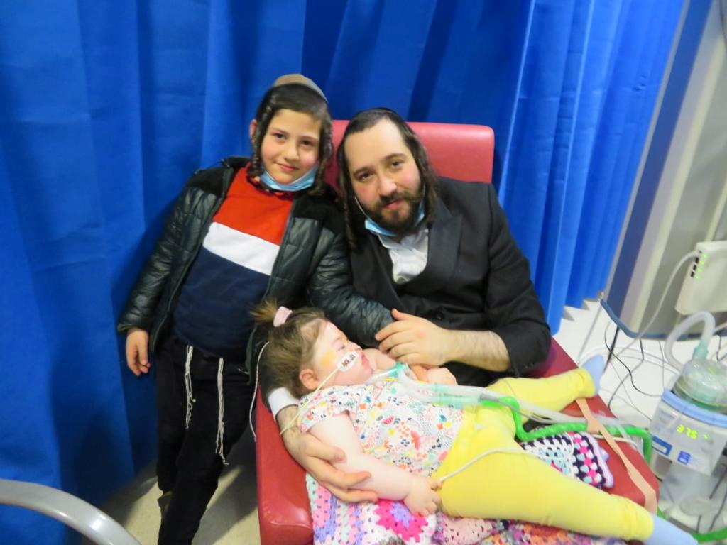 Alta is seen with her brother Tzvi and father Abraham, in Manchester