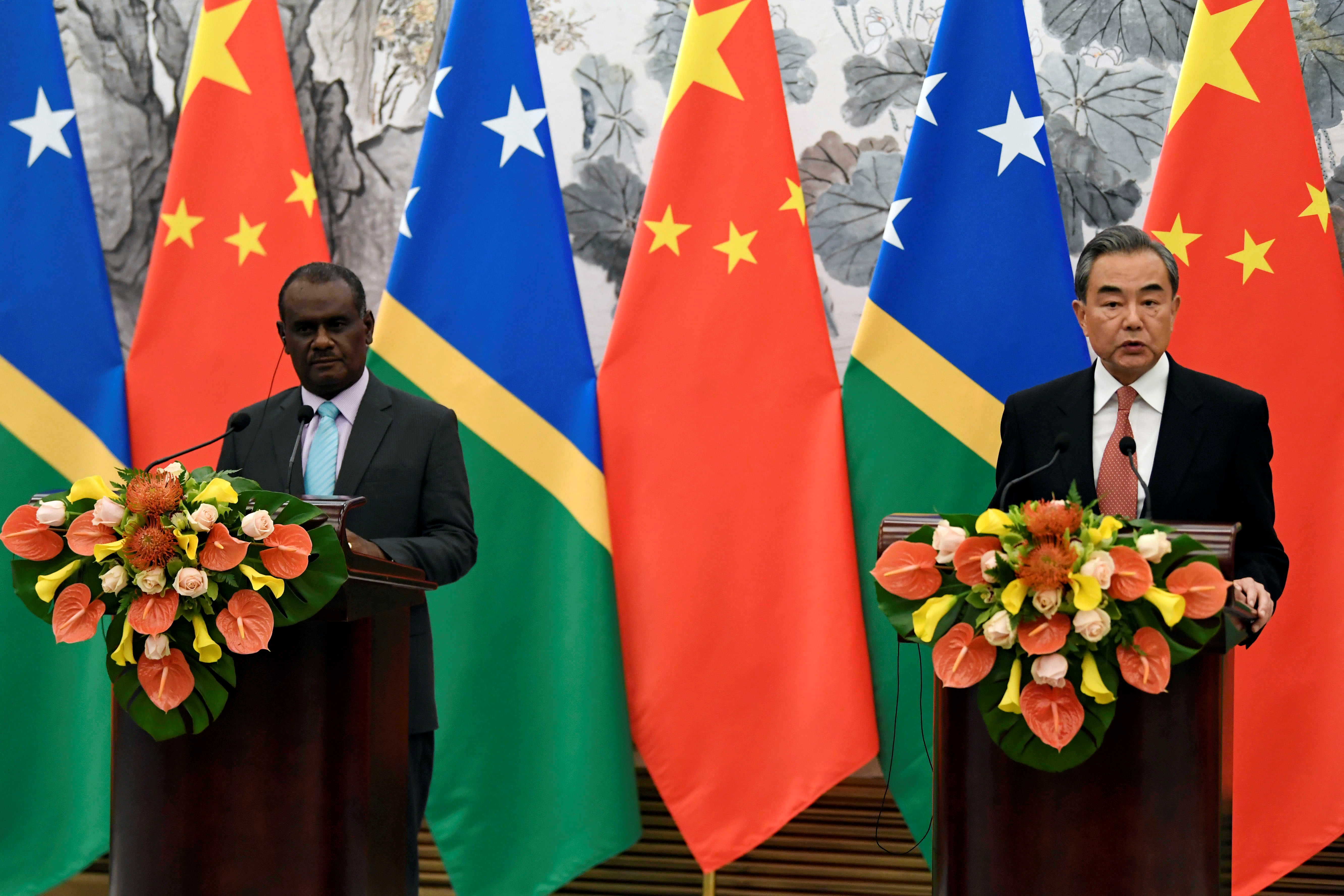 Solomon Islands Foreign Minister Jeremiah Manele and Chinese State Councilor and Foreign Minister Wang Yi hold joint news conference at the Diaoyutai State Guesthouse in Beijing