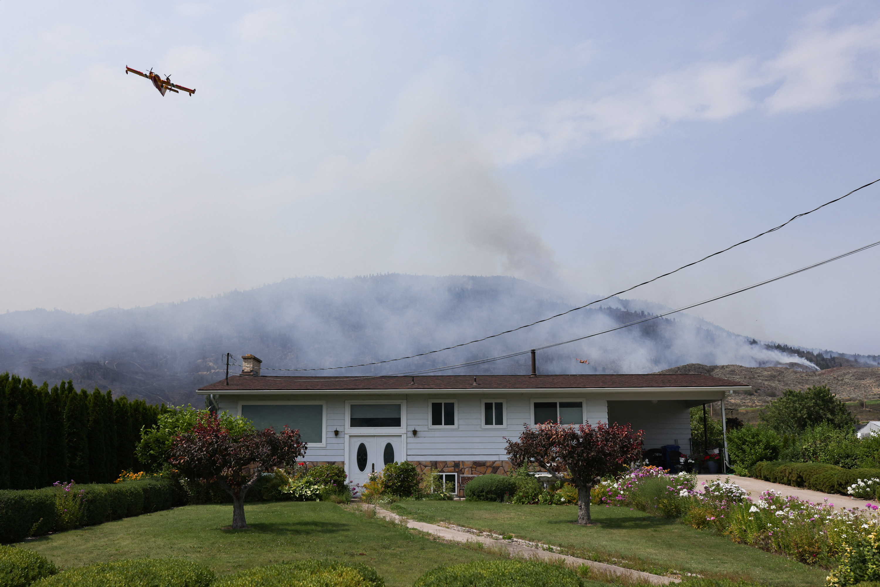 Evacuation order issued for western Canadian town as wildfire crosses ...
