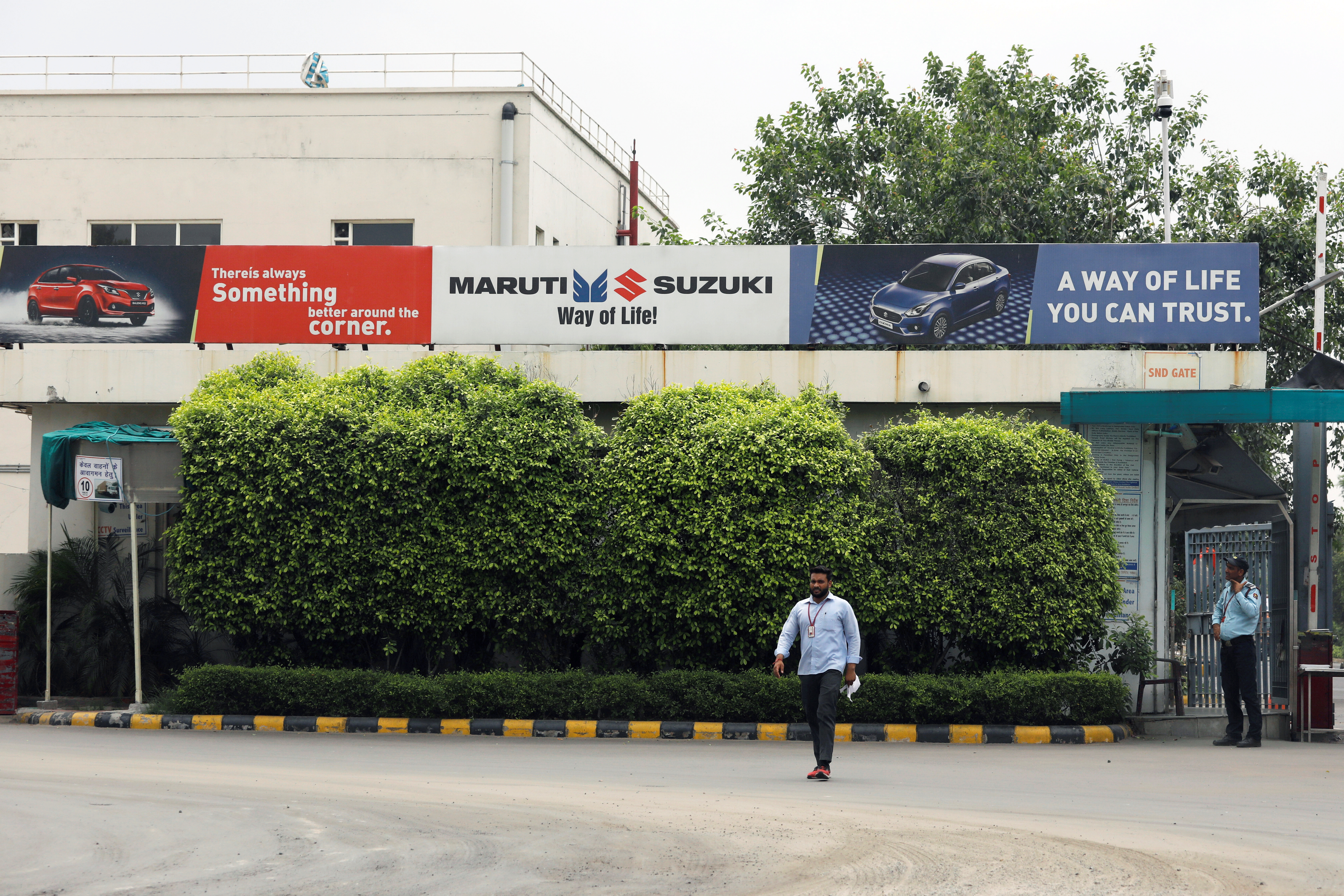 A man walks outside the Maruti Suzuki India Ltd. manufacturing plant in Manesar in the northern state of Haryana