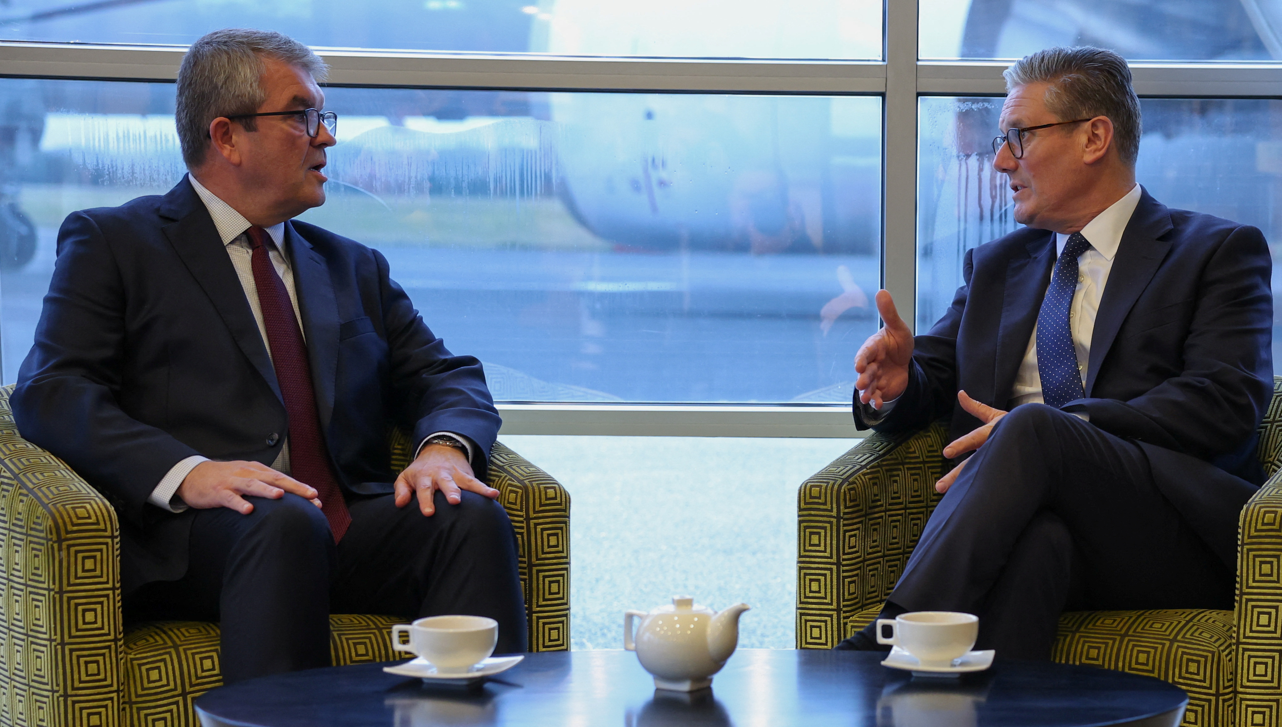 British Prime Minister Keir Starmer meets with the new UK Border Security Commander Martin Hewitt at an airfield near London