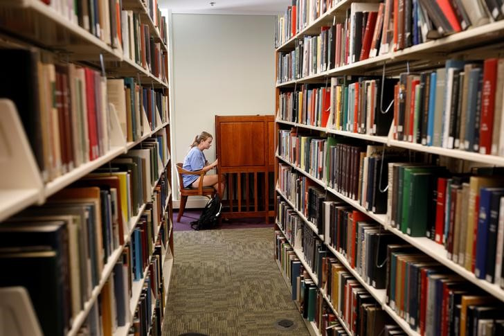 A student works at a cubicle in a library on the campus of the University of North Carolina at Chapel Hill North Carolina