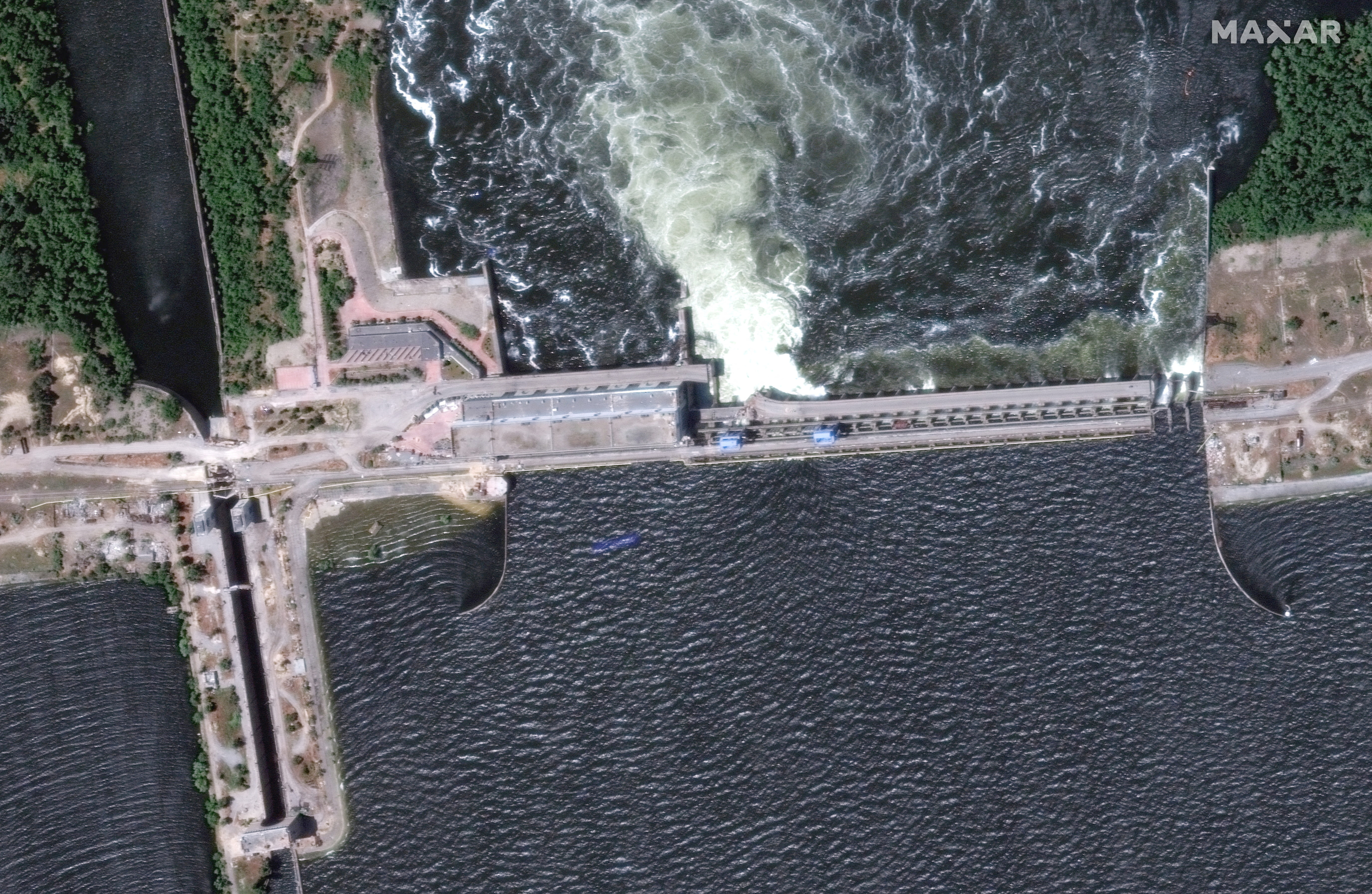 A satellite image shows extensive flooding along the Dnipro River