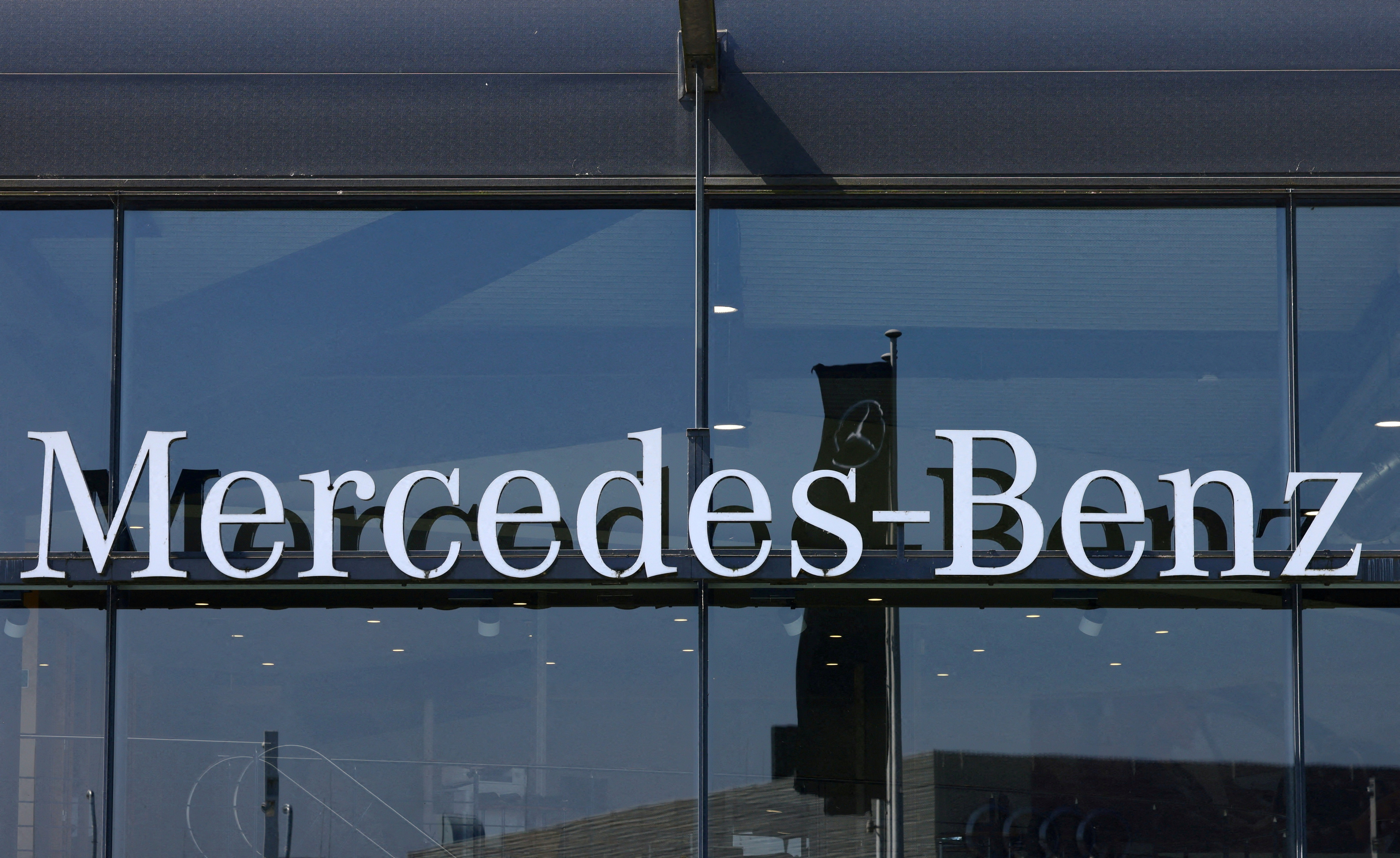 The logo of Mercedes-Benz is seen outside a Mercedes-Benz car dealer in Brussels, Belgium