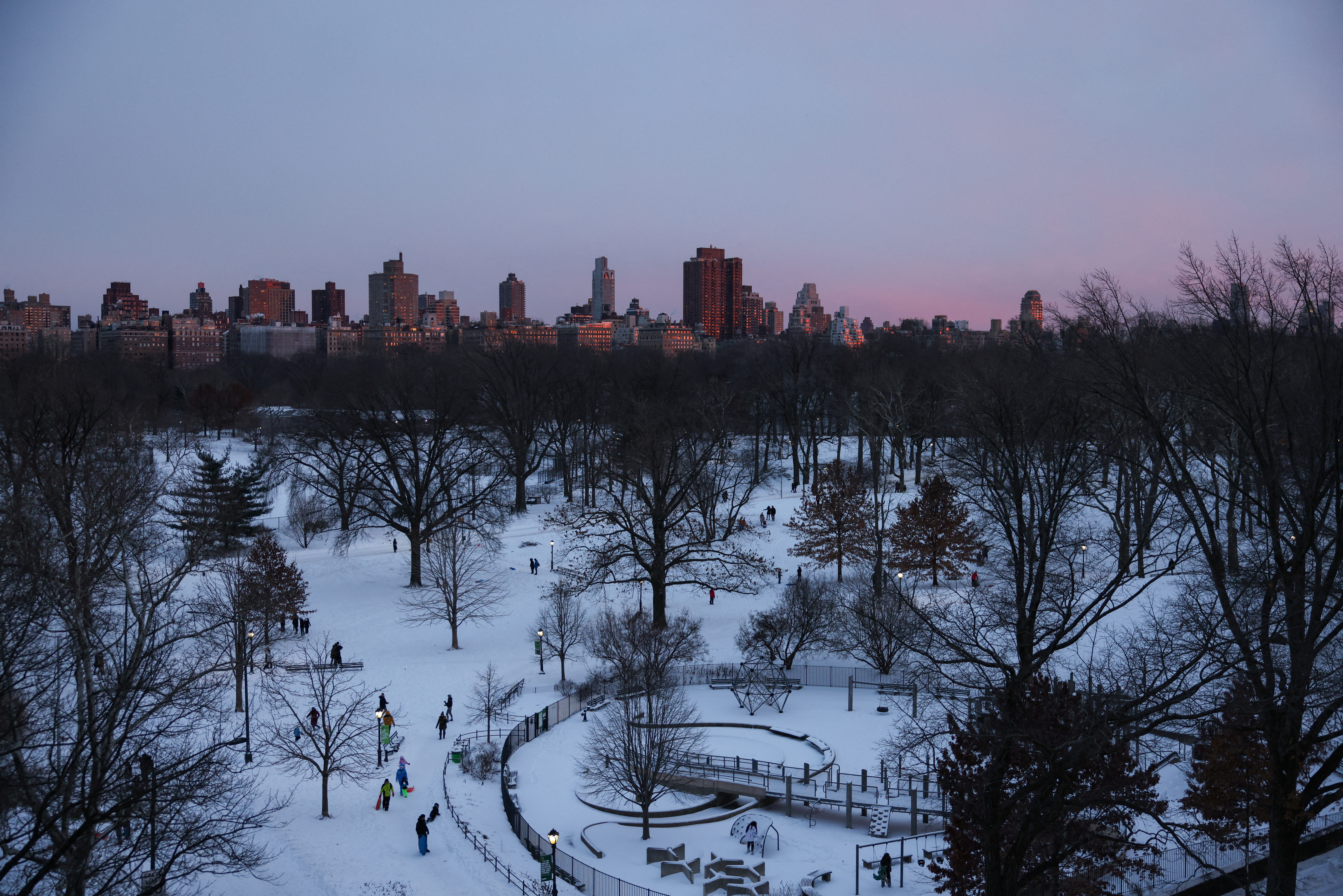 The sun sets over Central Park following a powerful nor'easter storm in New York City, US, January 29, 2022.  Reuters/Caitlin Ochs