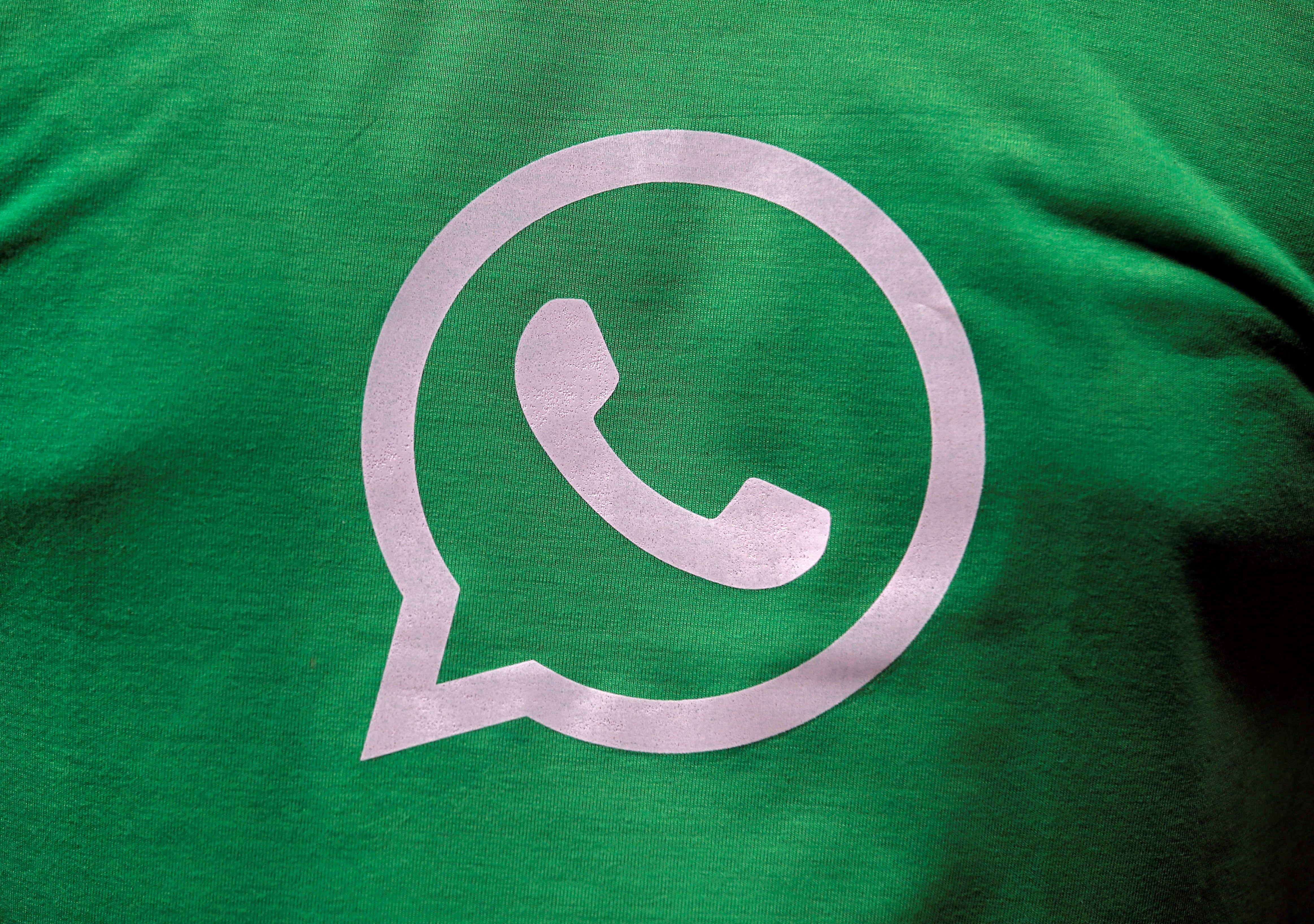 A logo of WhatsApp is pictured on a T-shirt worn by a WhatsApp-Reliance Jio representative during a drive by the two companies to educate users, on the outskirts of Kolkata
