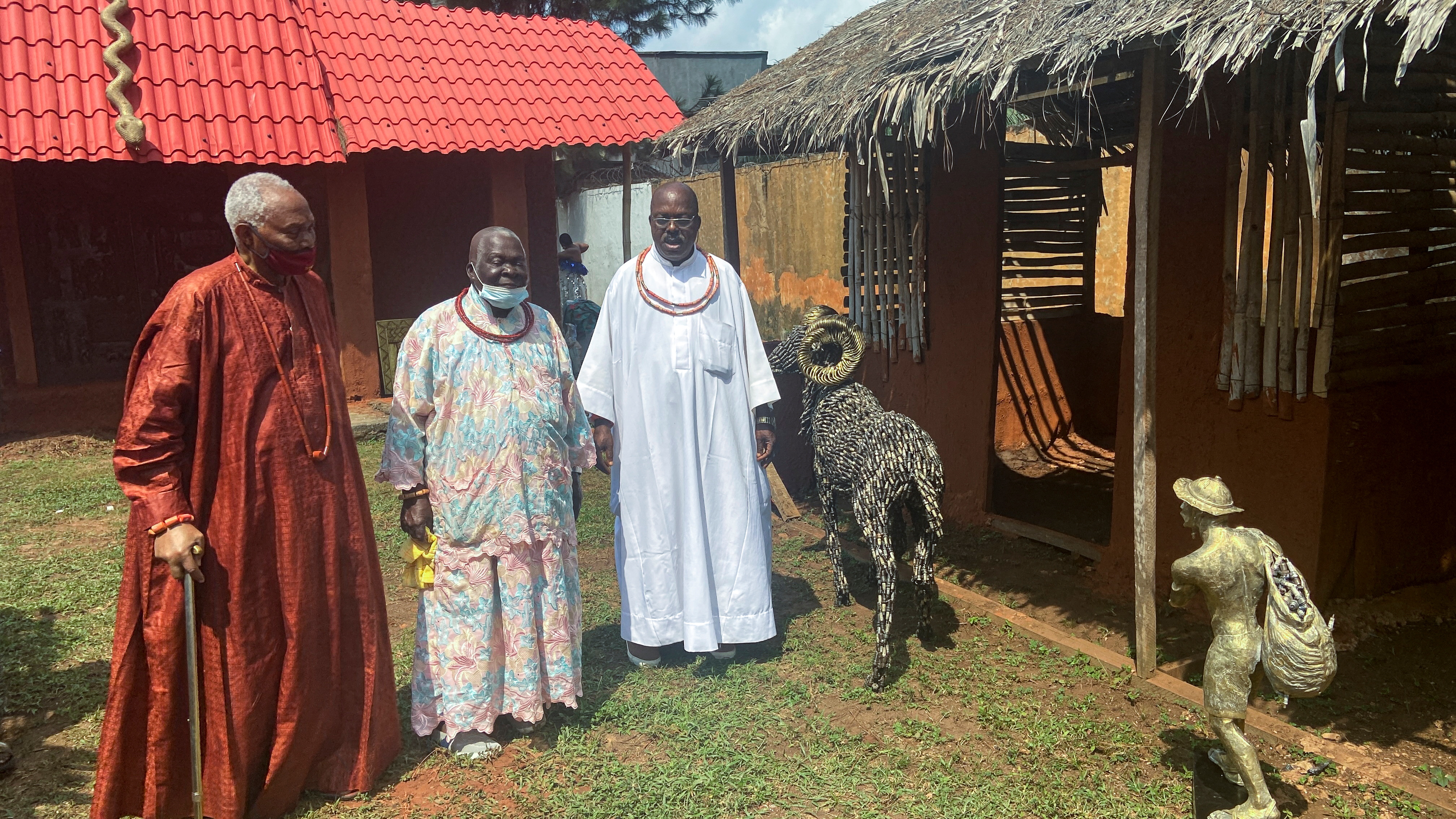 Nigerian traditional chiefs stand next to a life-size ram made out of spark plugs, one of the artworks offered as a gift to the British Museum by a new guild of artists, at the unveiling of the artworks in Benin City, Nigeria, July 31, 2021. REUTERS/Tife Owolabi