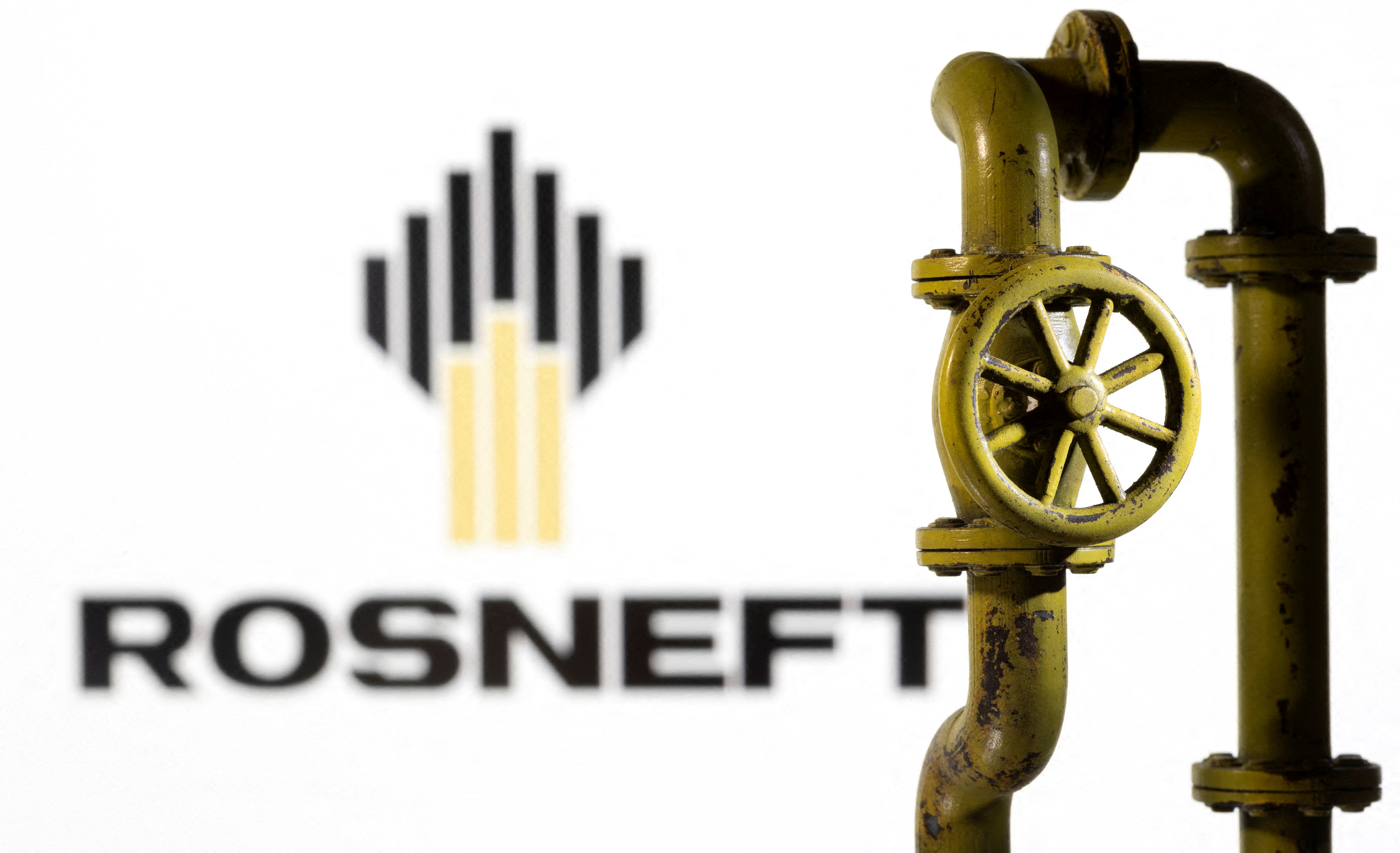 Illustration shows Rosneft logo and natural gas pipeline