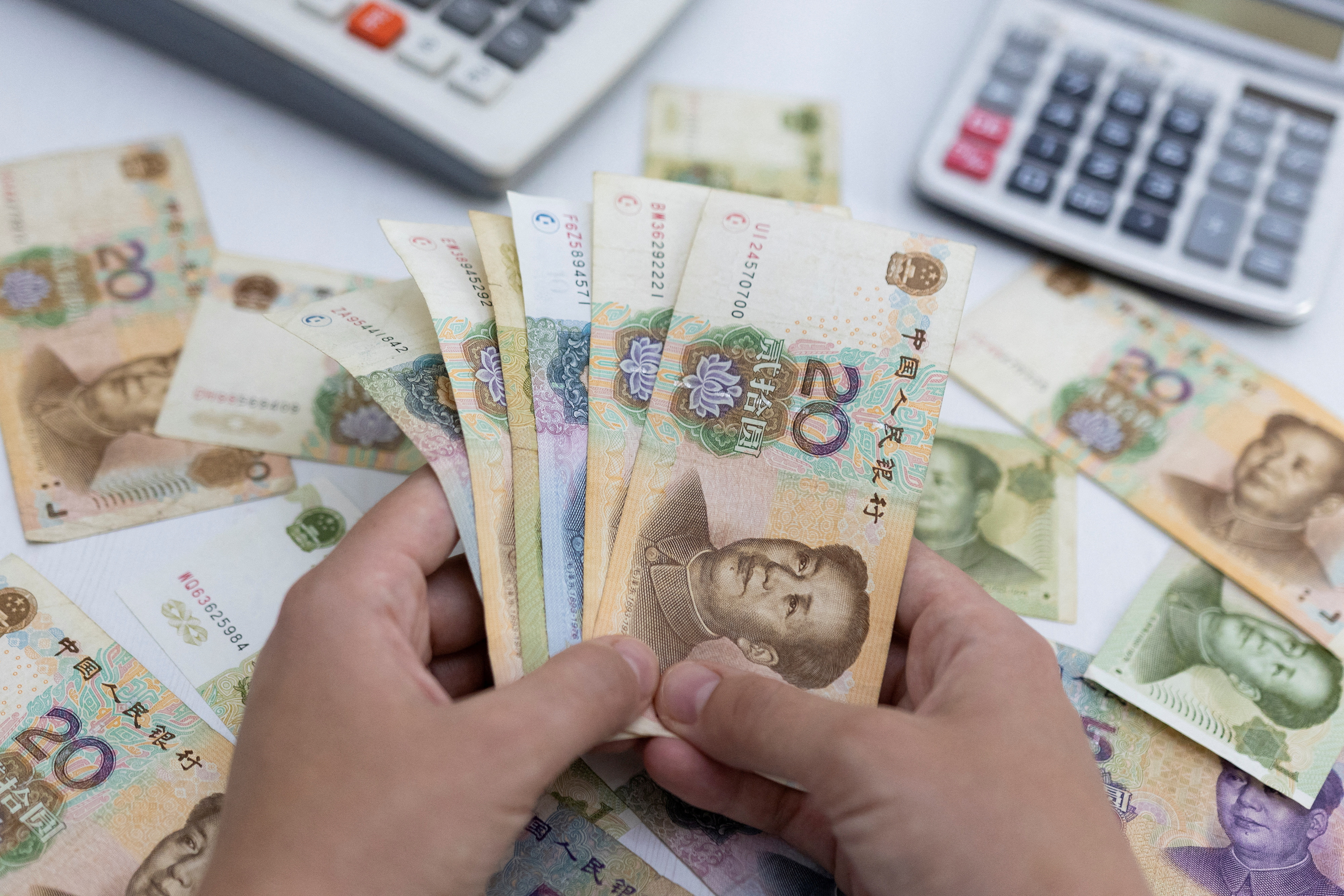 Illustration shows Chinese Yuan banknotes