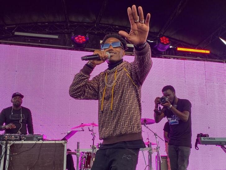 Kenyan rapper and activist Octopizz preforms during a concert promoting registration to vote in the August Kenyan general elections, in Eldoret