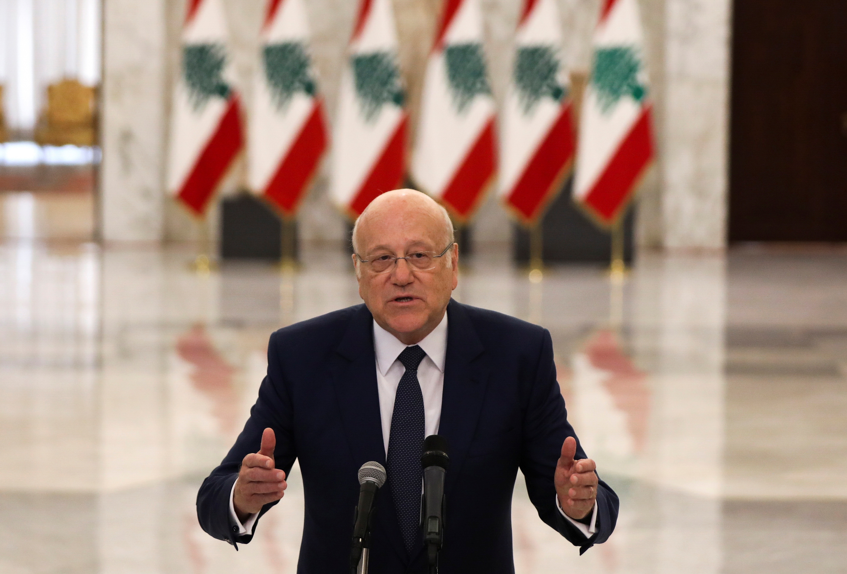 Lebanon's new Prime Minister-Designate Najib Mikati, gestures as he talks at the presidential palace in Baabda