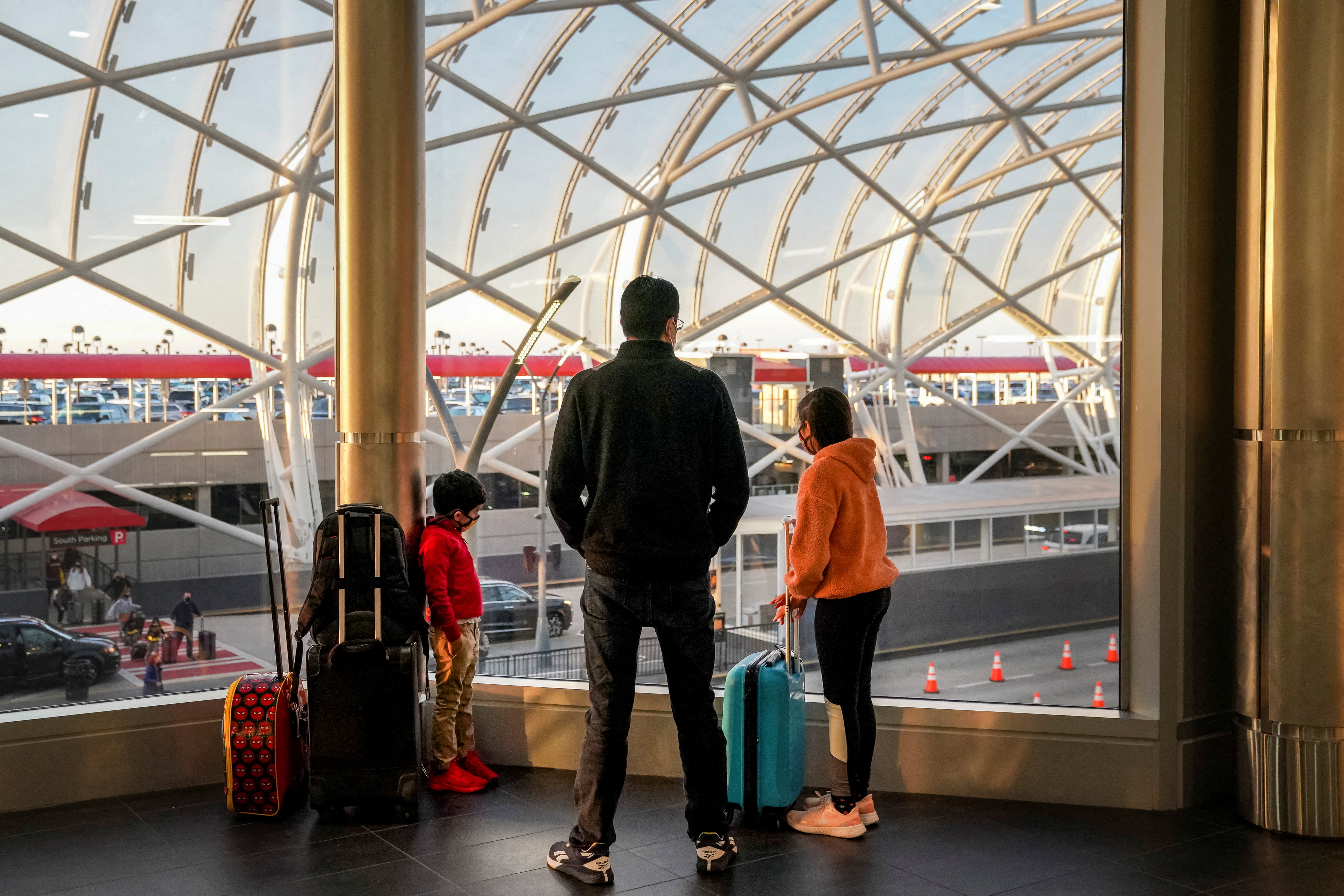 Travelers are seen at Hartsfield-Jackson Atlanta International Airport in Atlanta, Georgia, U.S. December 22, 2021. REUTERS/Elijah Nouvelage