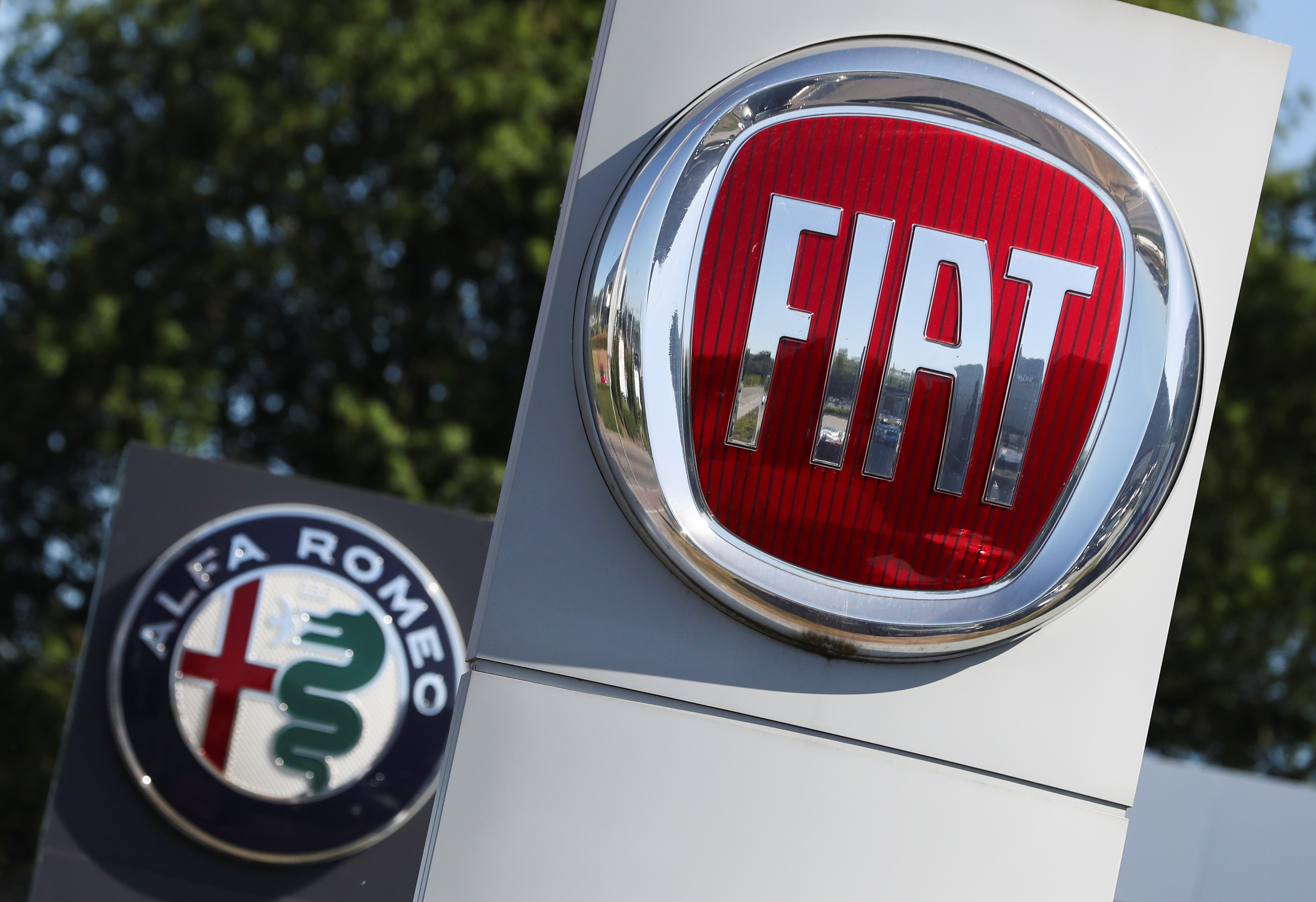 Logos of Fiat and Alfa Romeo are seen outside a car dealer, amid the coronavirus disease (COVID-19) outbreak in Brussels