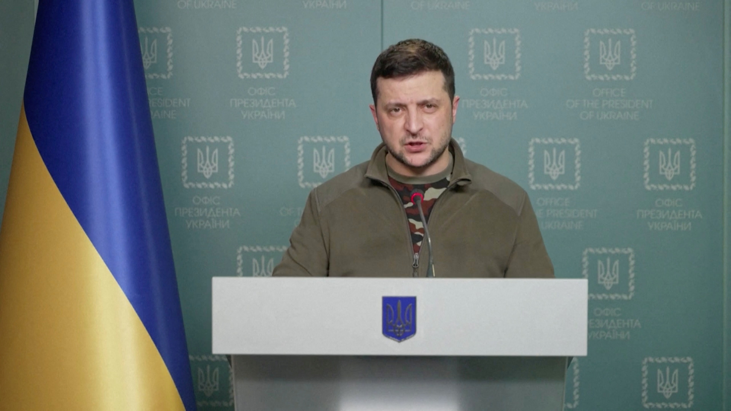 Ukrainian President Volodymyr Zelenskiy speaks during a video address in Kyiv