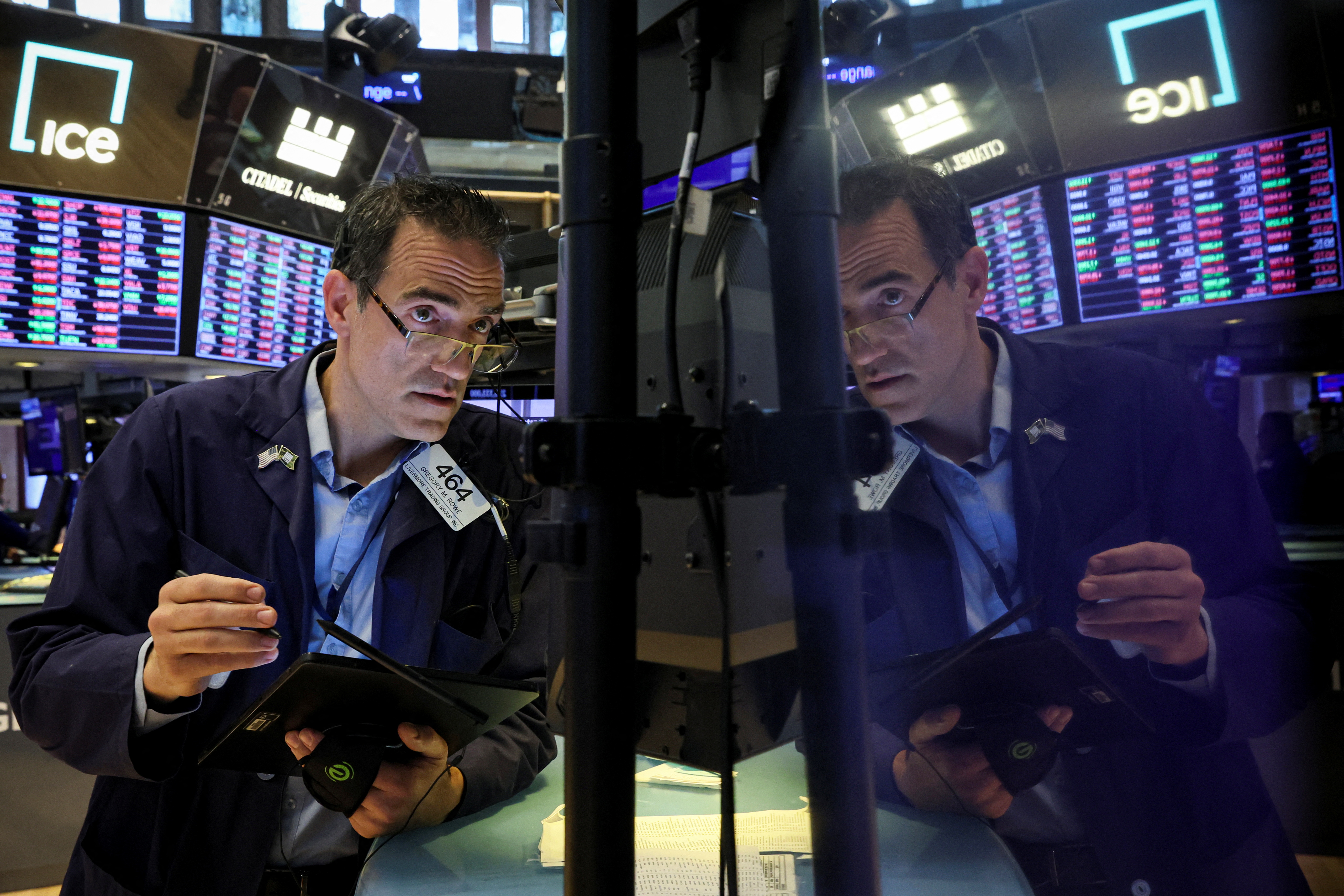 Traders work on the floor of the NYSE in New York