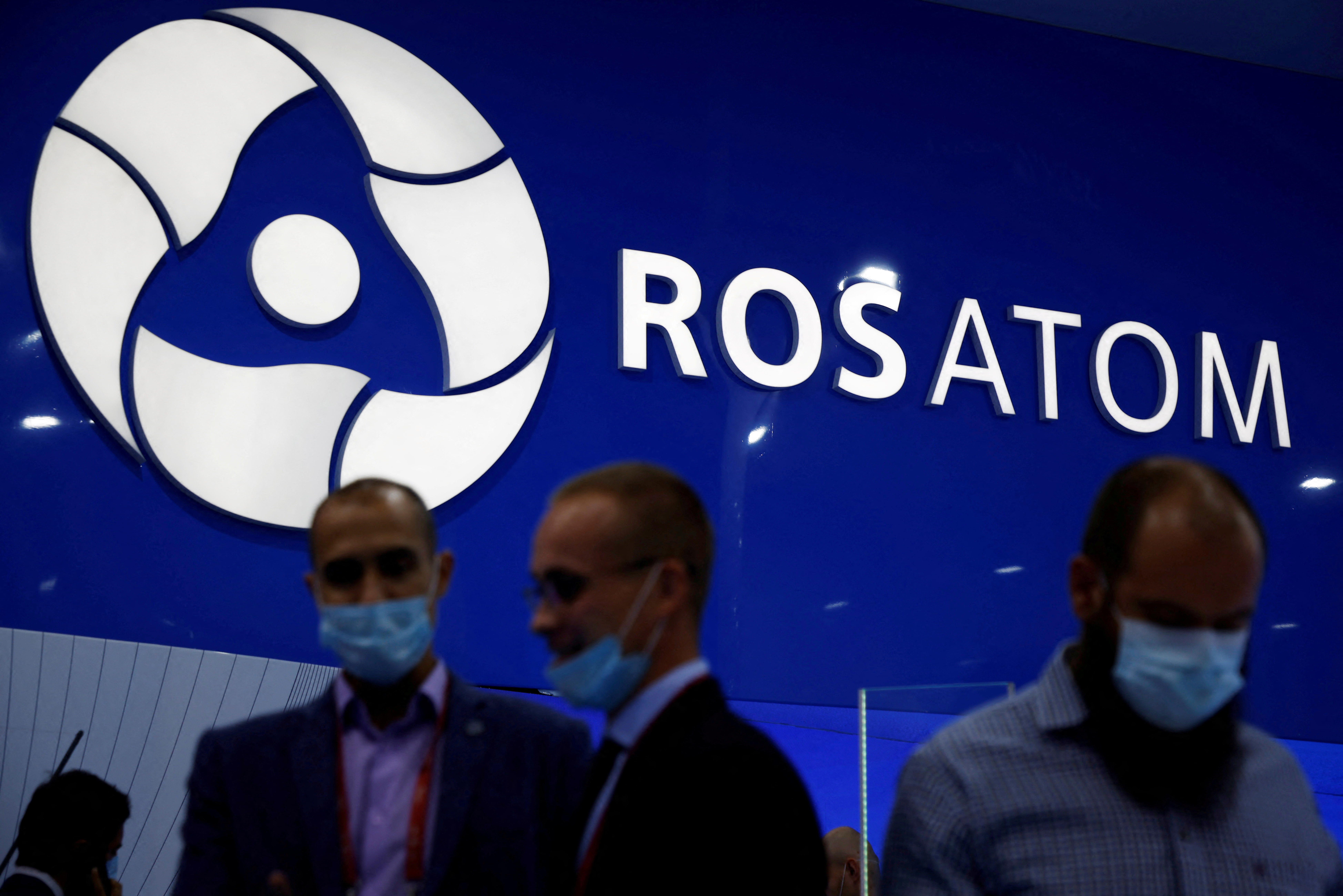 Participants are seen at the stand of Russian state nuclear agency Rosatom during the International military-technical forum 