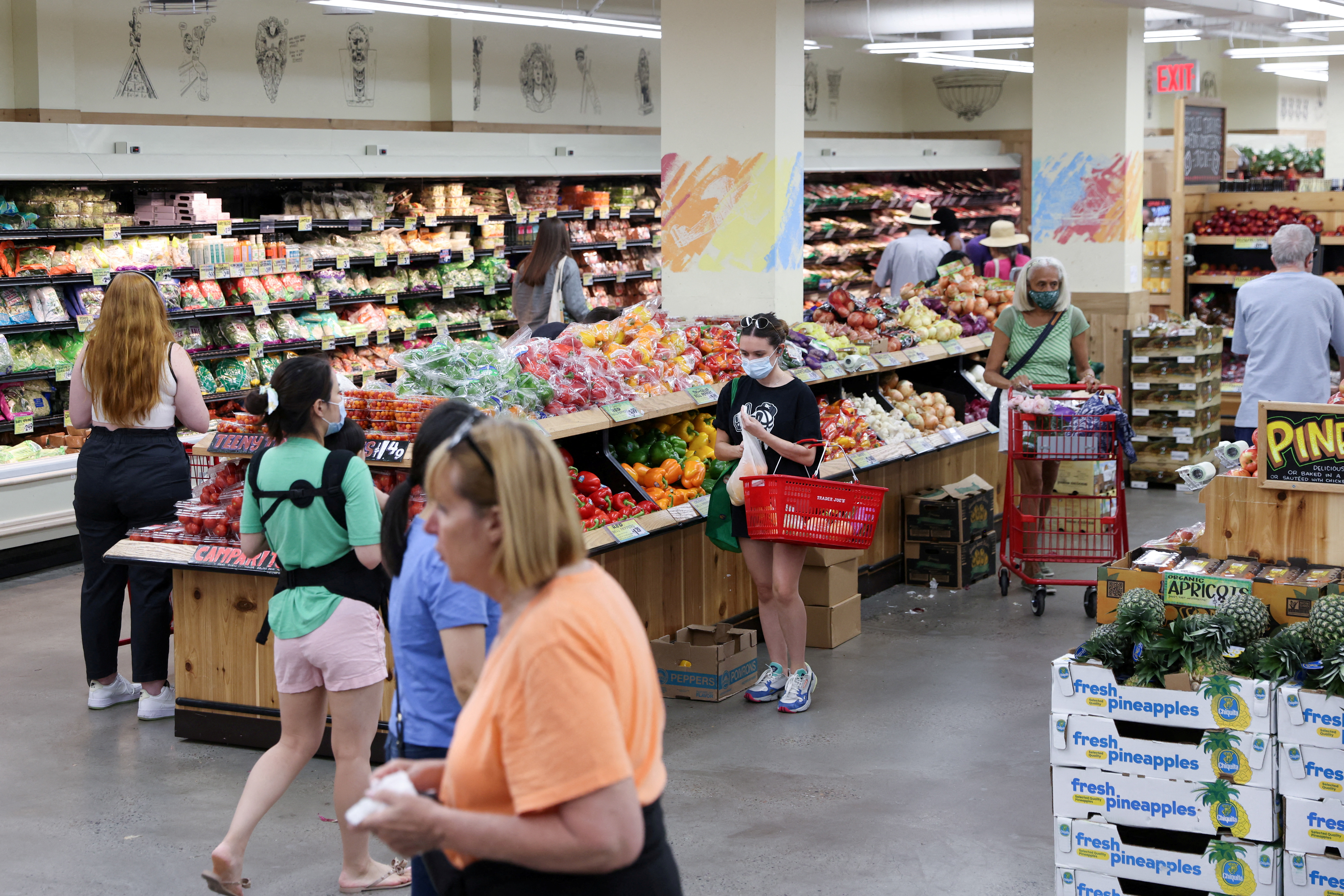 People shop in a supermarket as inflation affected consumer prices in Manhattan, New York City
