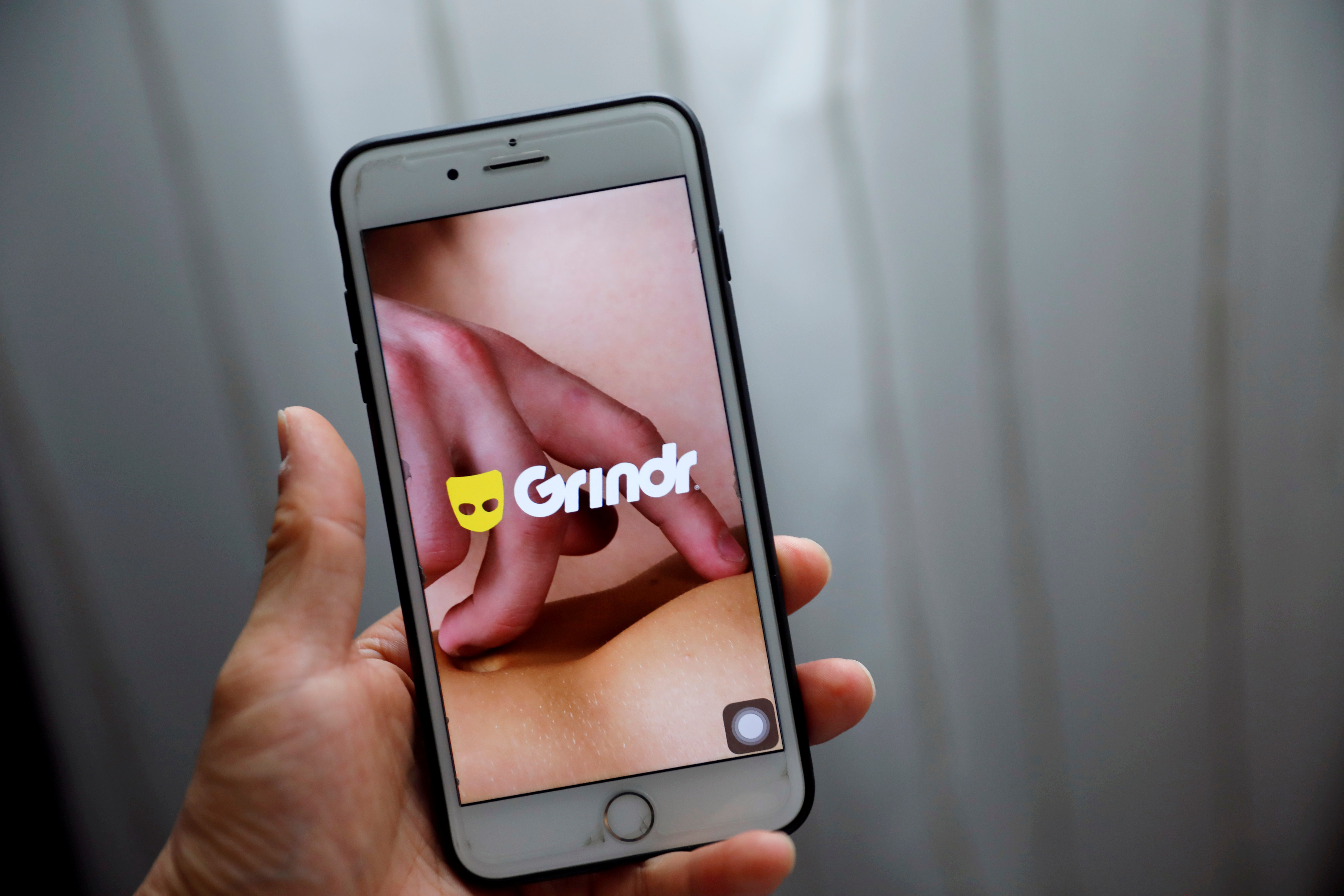 Grindr app is seen on a mobile phone in this photo illustration taken in Shanghai