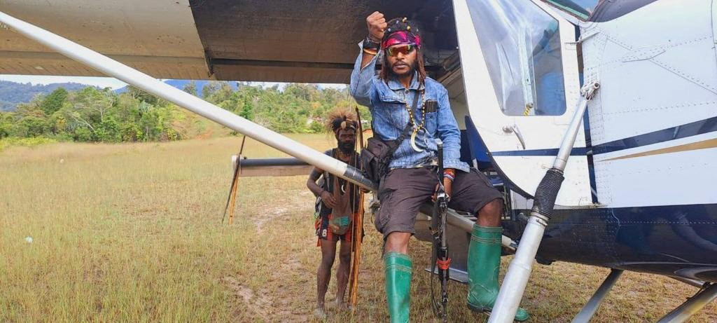 Egianus Kogoya, young West Papuan rebel commander, sits on a captured plane piloted by New Zealand national Philip Mehrtens in Indonesia's Papua region