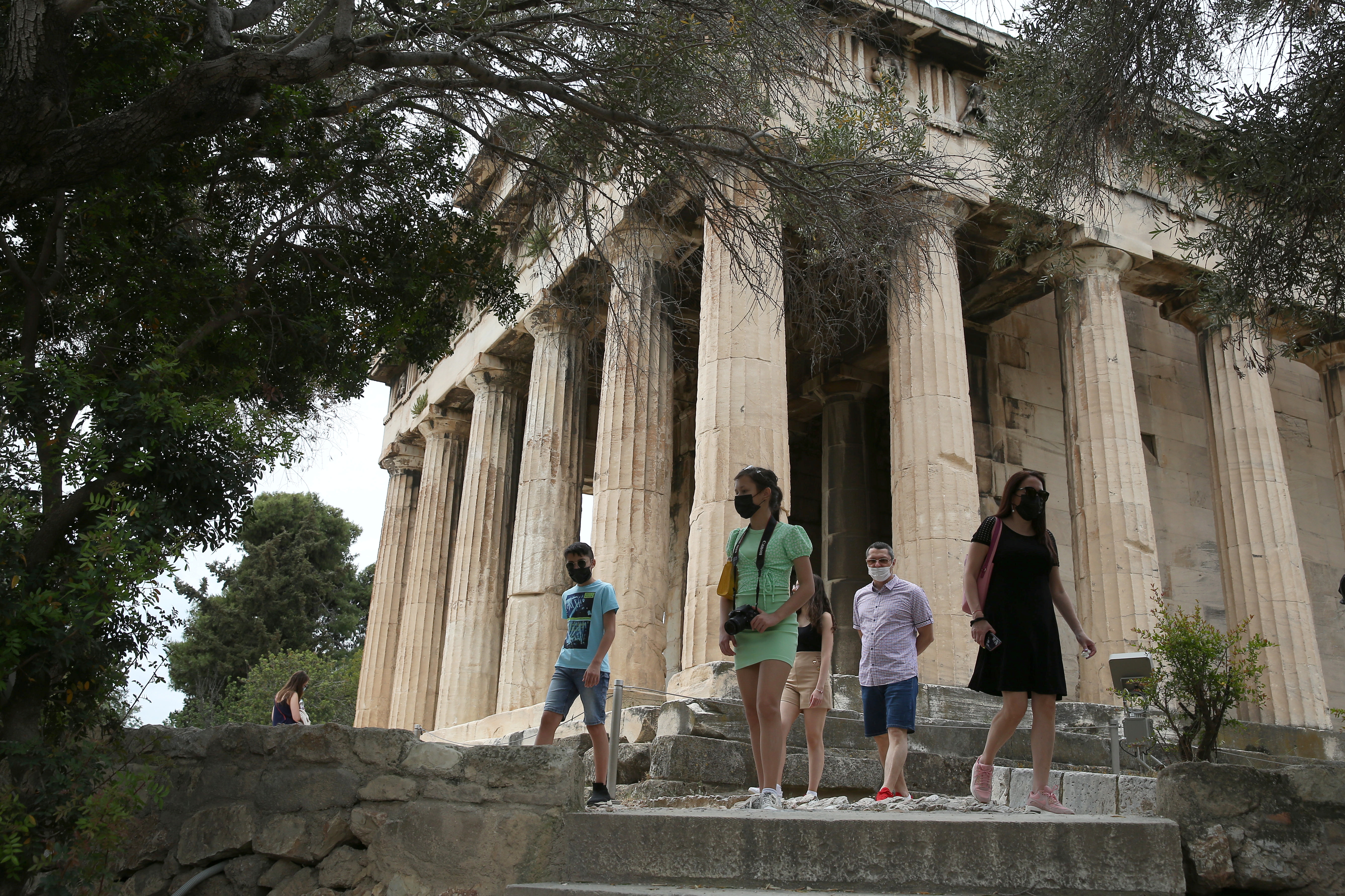 Tourists visit ancient temple of Hephaestus in Athens