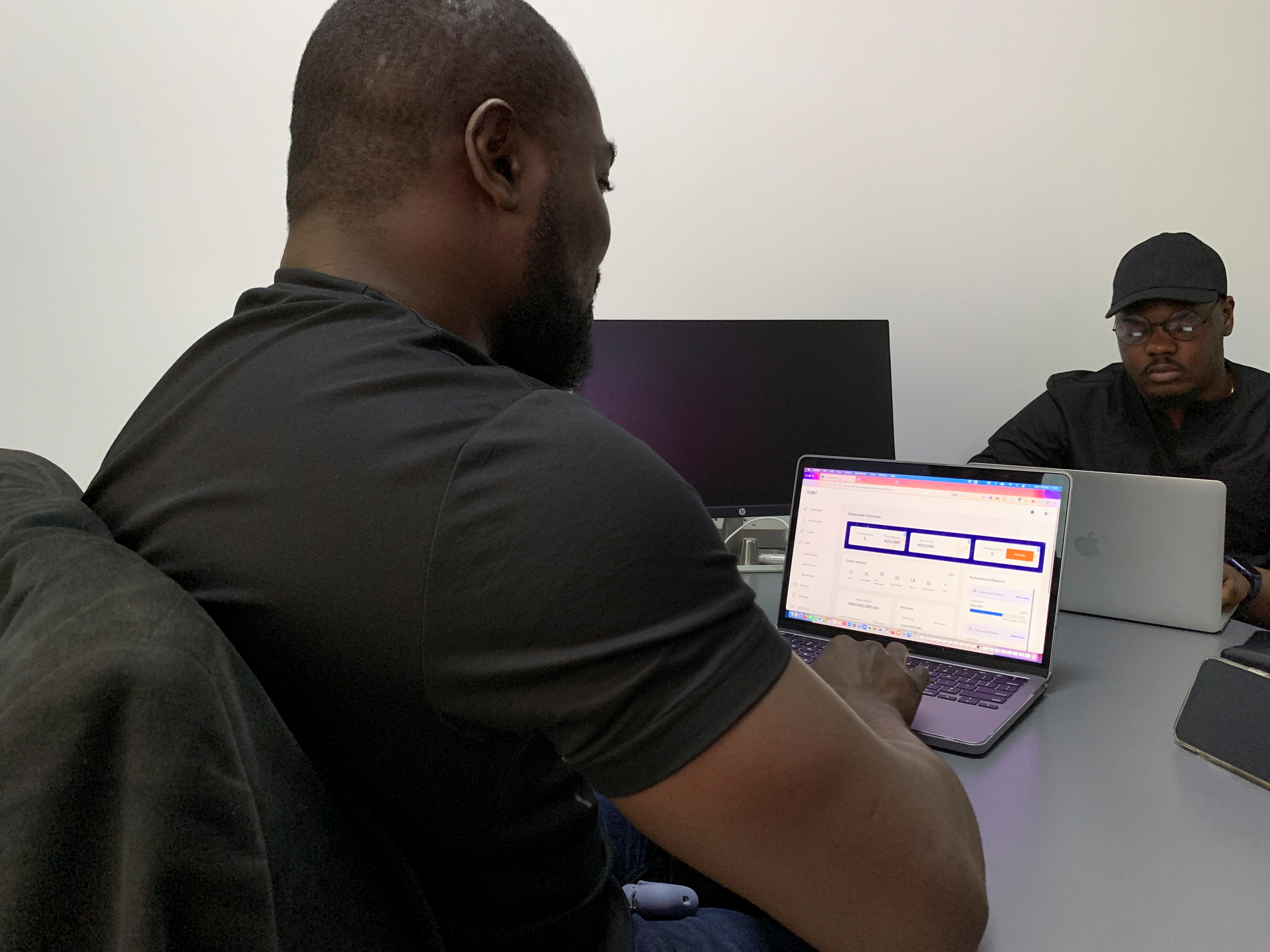 Staffs work on the backend of Sabi online groceries website at the office in Lagos
