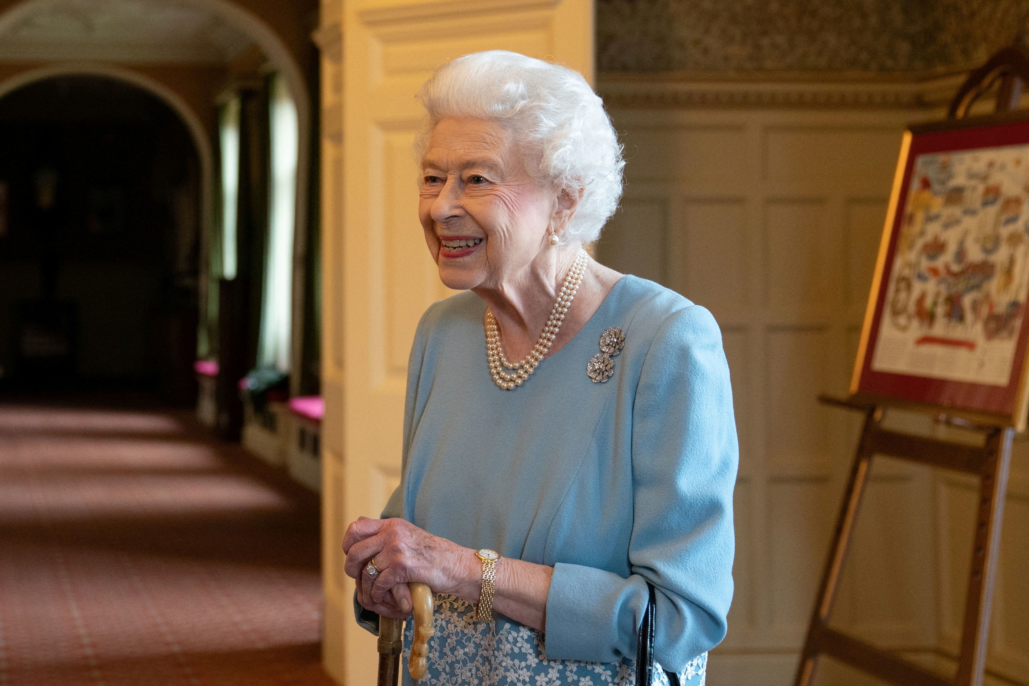 Britain's Queen Elizabeth reacts as she attends a reception in the Ballroom of Sandringham House to celebrate the start of the Platinum Jubilee, in Sandringham, Britain, February 5, 2022. Joe Giddens/ Pool via REUTERS
