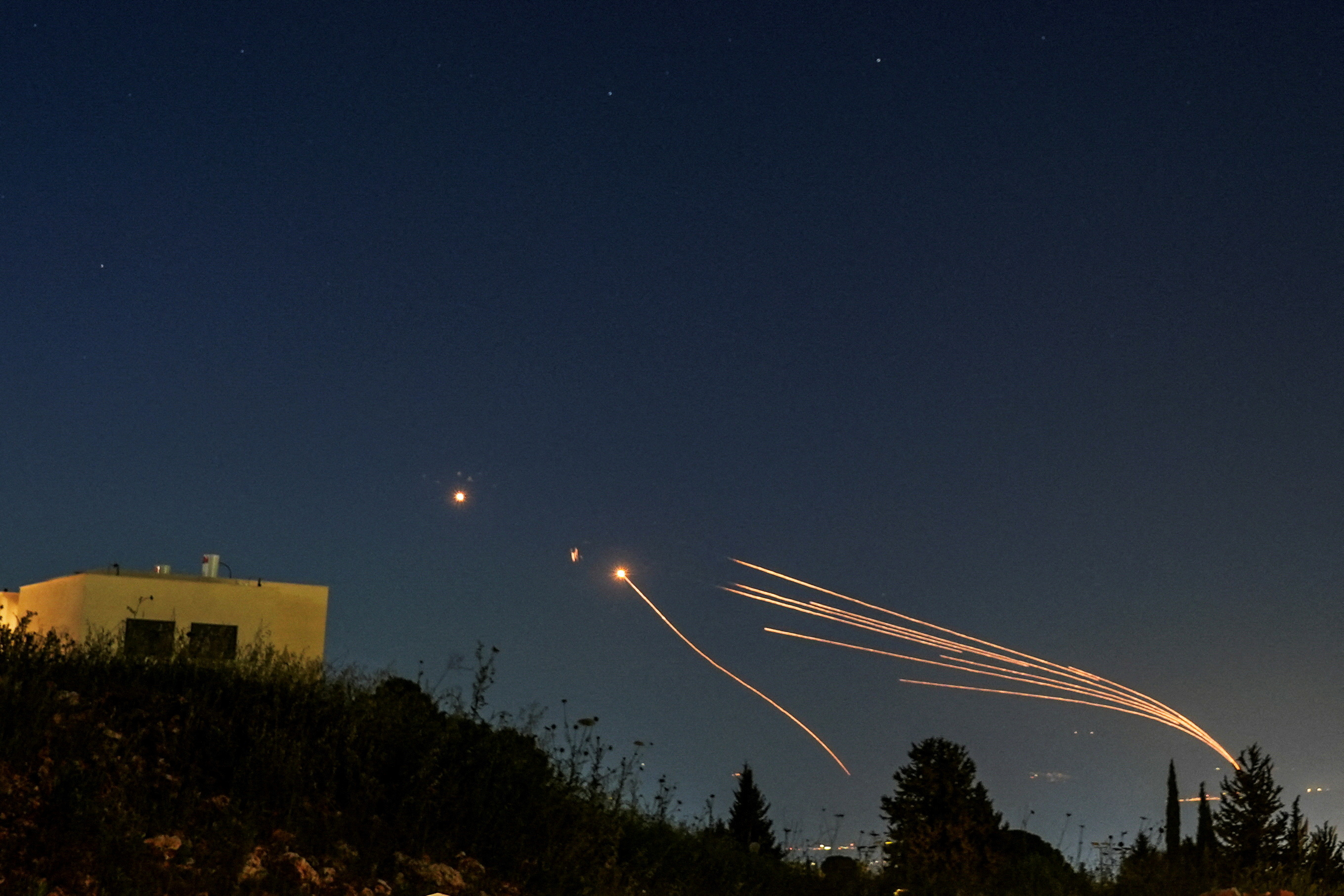 Israel's Iron Dome anti-missile system intercepts rockets launched from Lebanon towards Israel over the Israeli Lebanese border