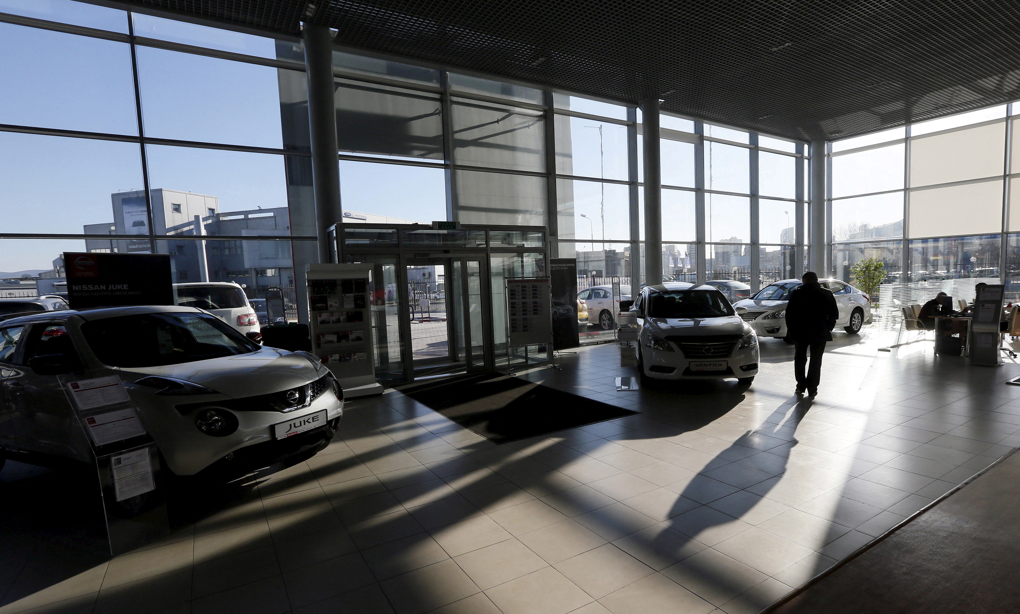 Customer looks at cars at Nissan and Datsun showroom in Krasnoyarsk