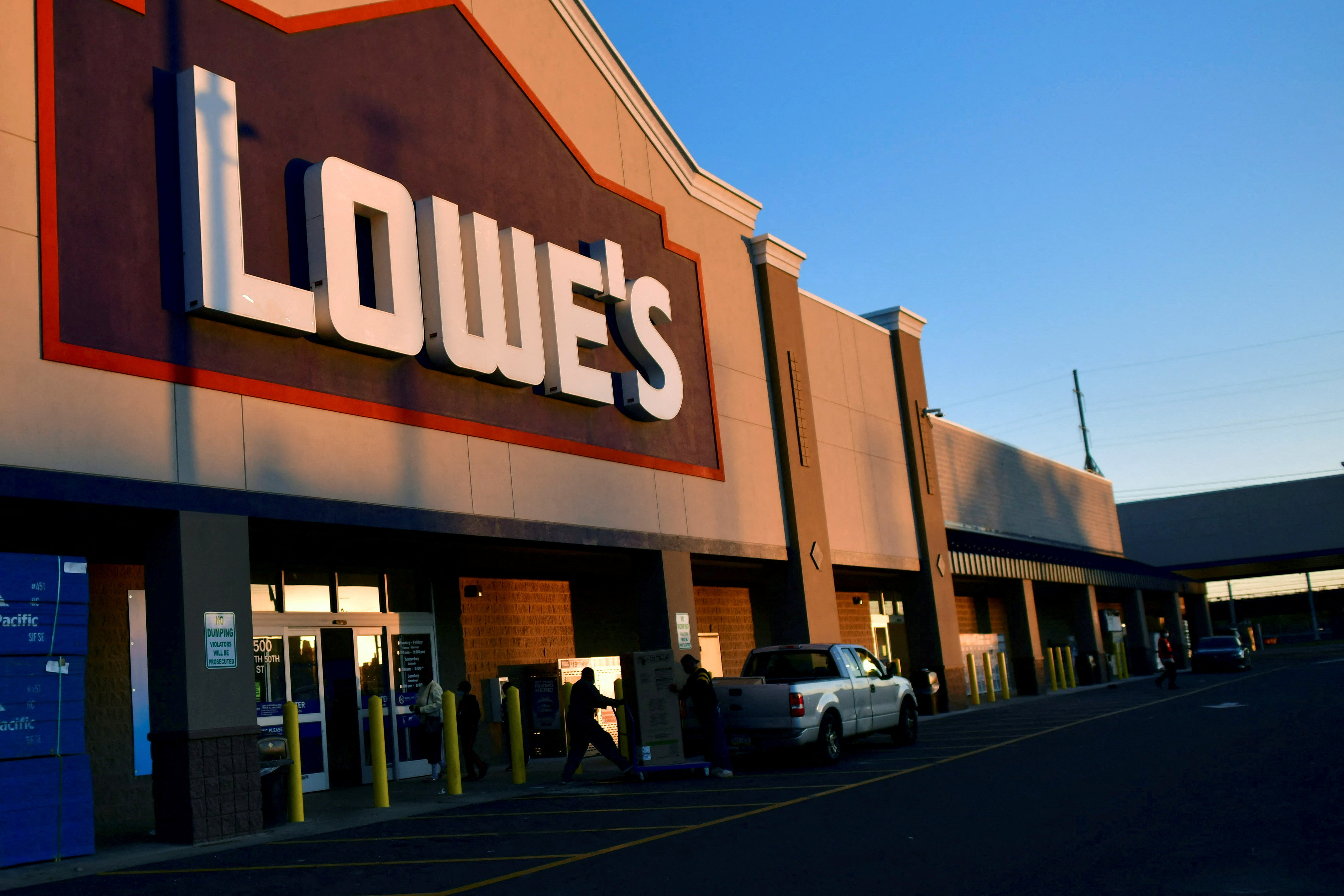 Shoppers departs after visiting a Lowe's hardware store in Philadelphia