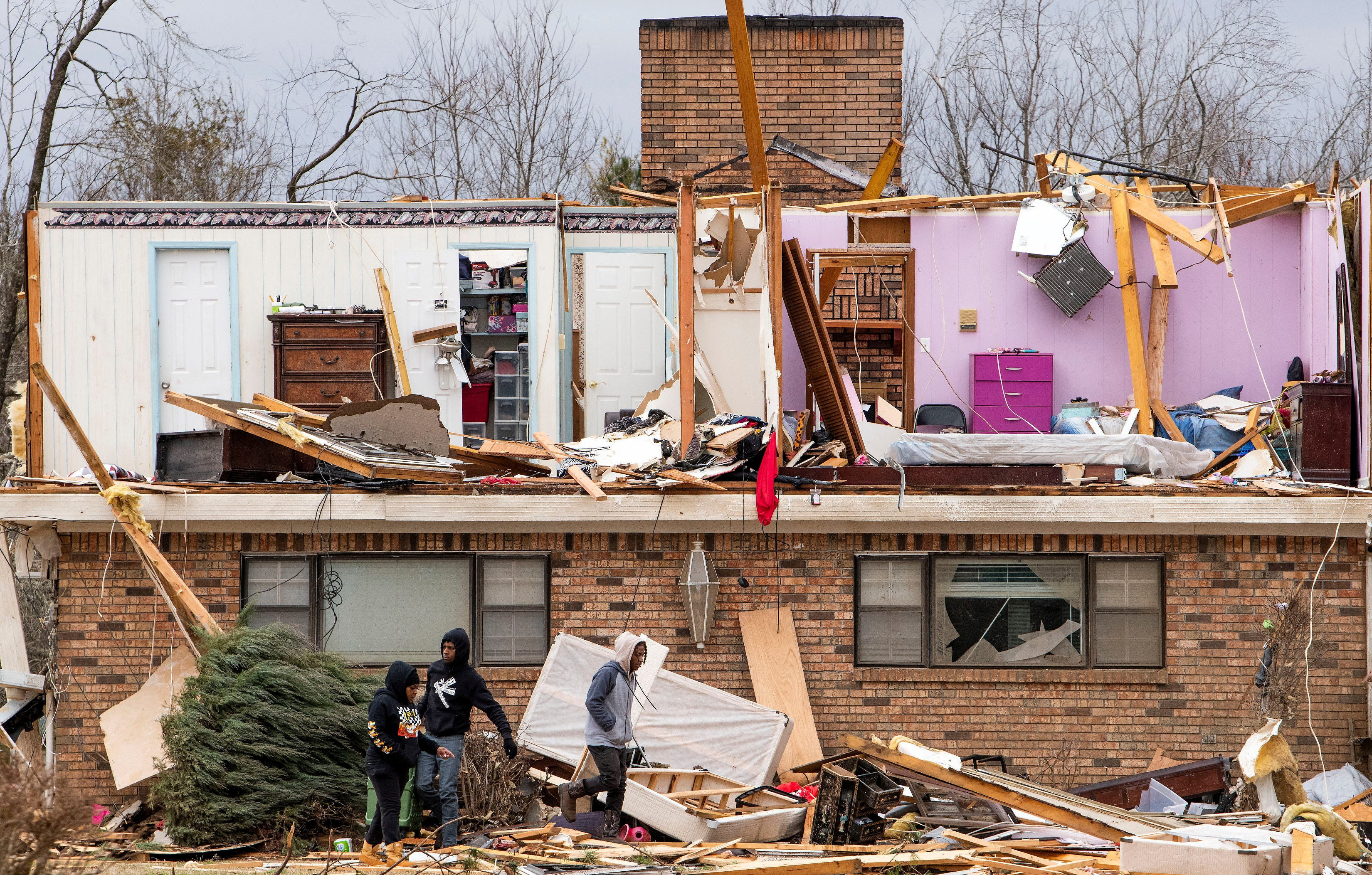 Whole rooms are seen on the second floor of a home the day after a tornado struck Dallas County