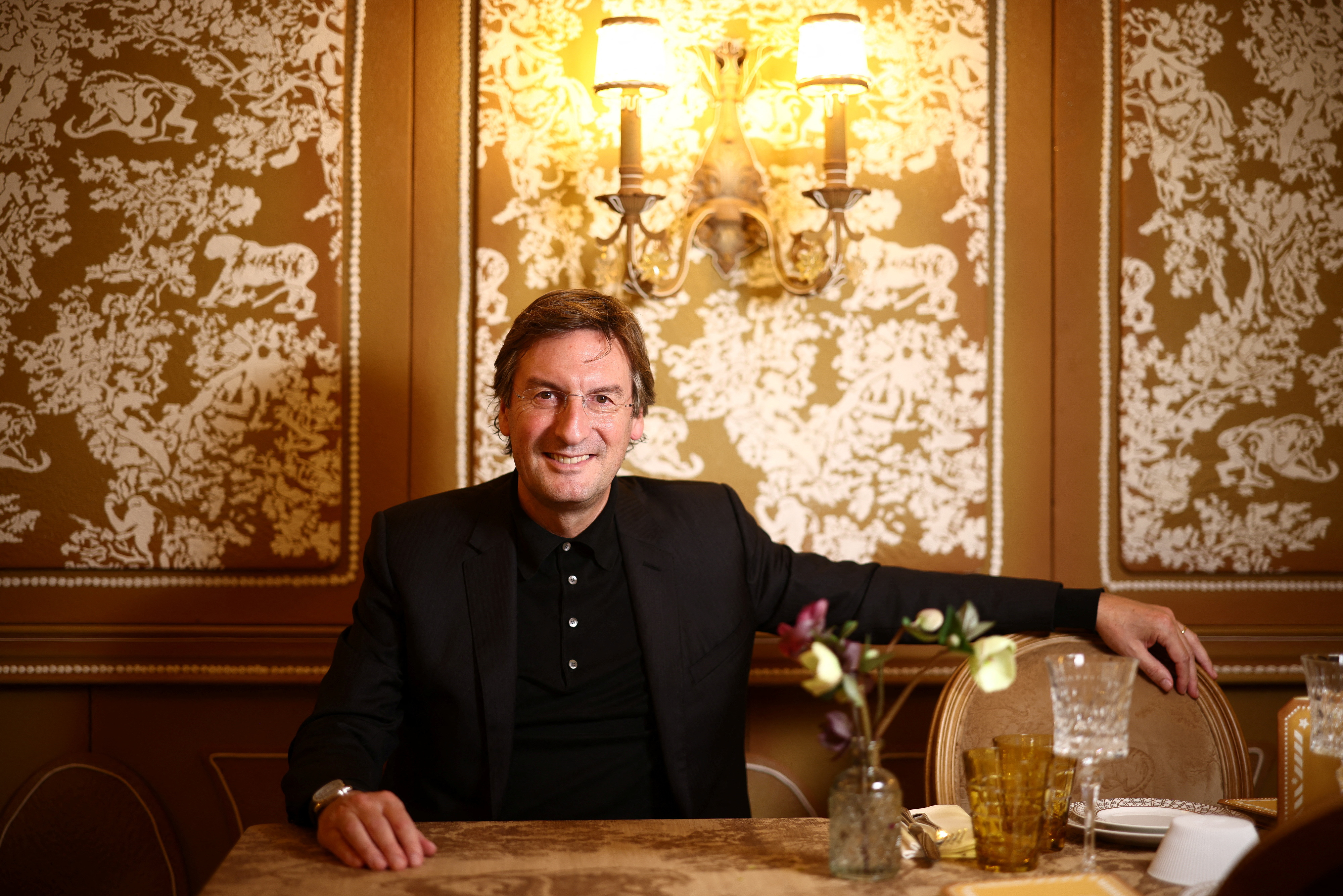 Dior CEO Pietro Beccari poses following an interview with Reuters at the Dior cafe at Harrods in London