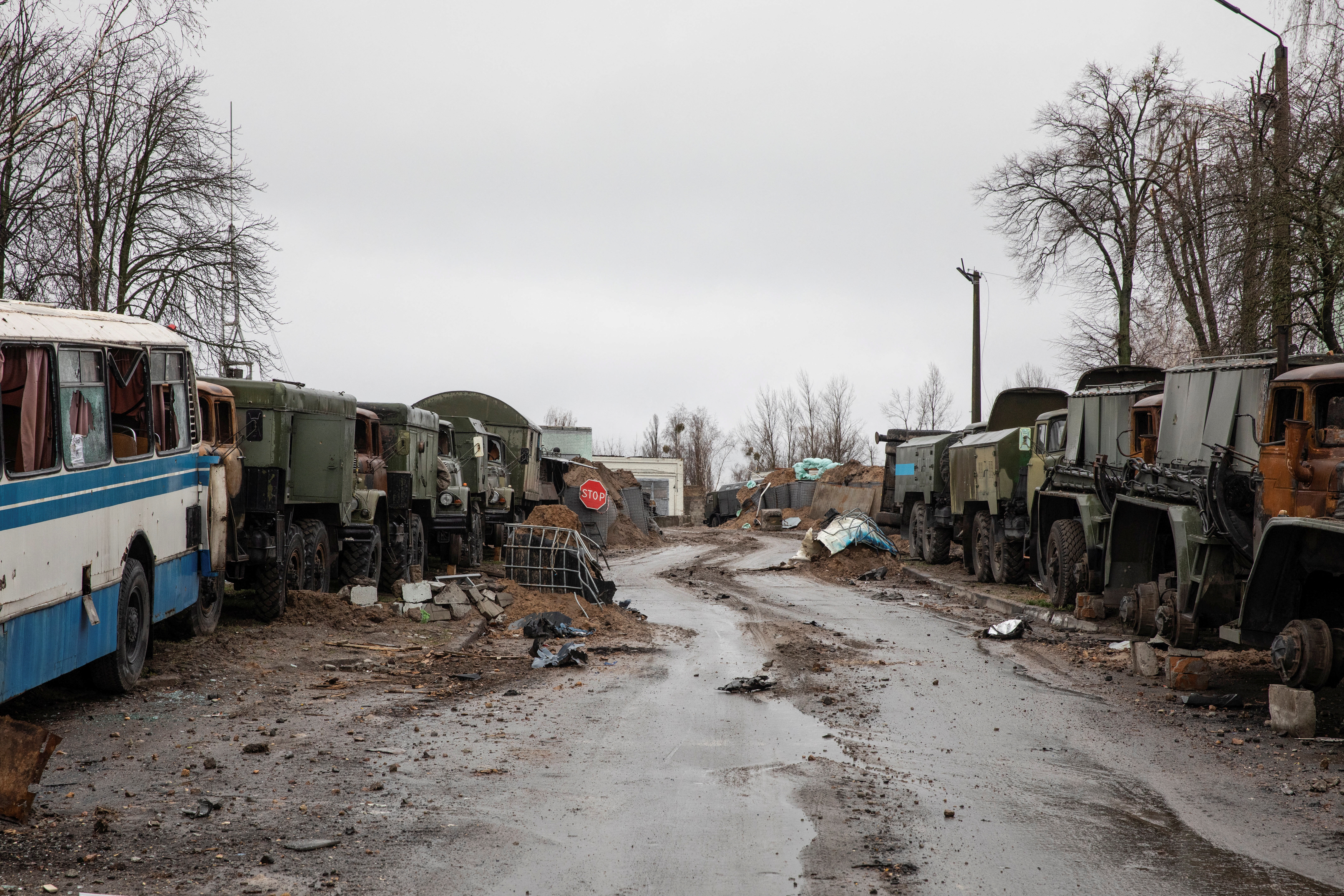 Damaged military tracks are seen at an entrance to the Antonov airfield in the settlement of Hostomel