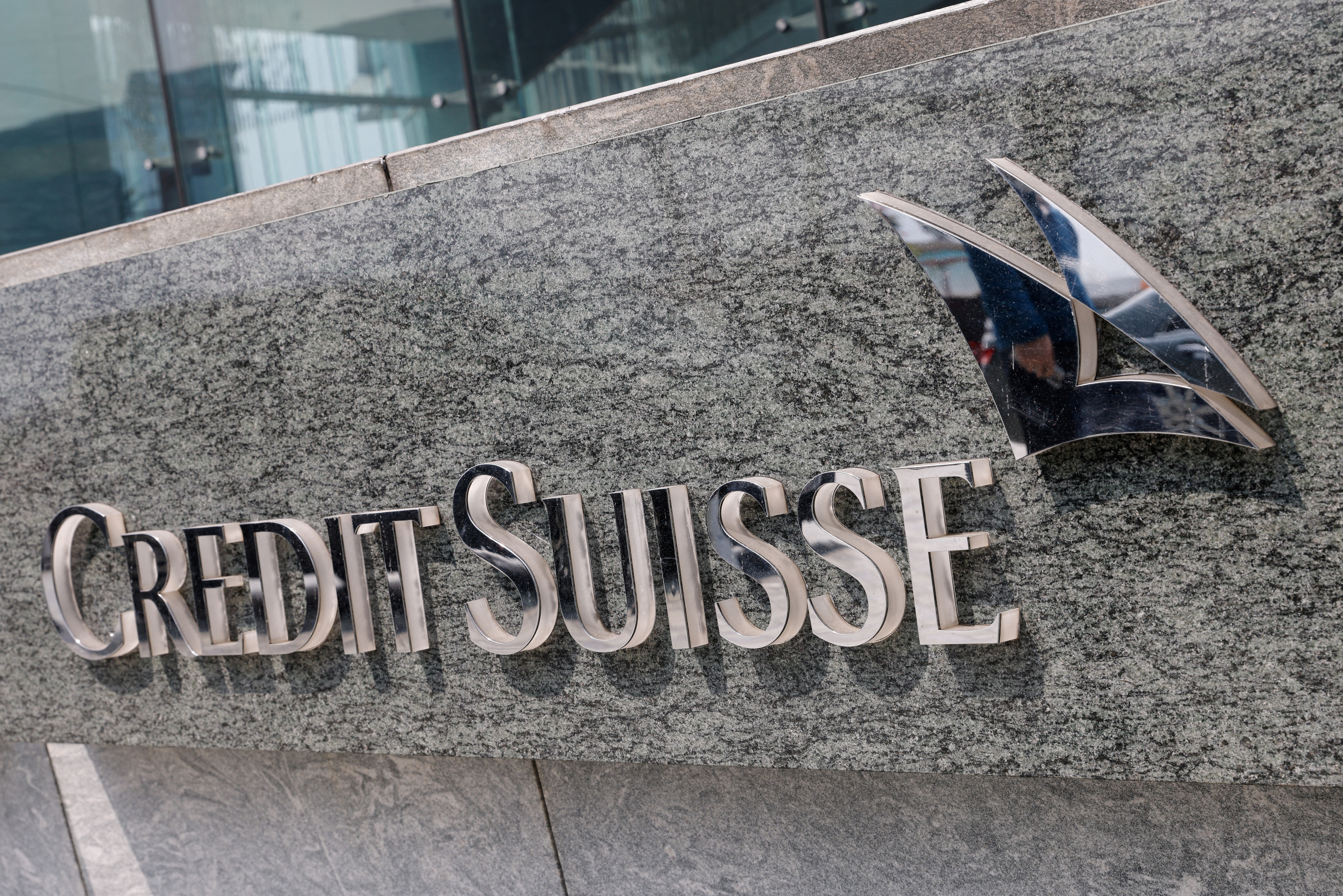 The logo of Credit Suisse is seen outside its office building in Hong Kong