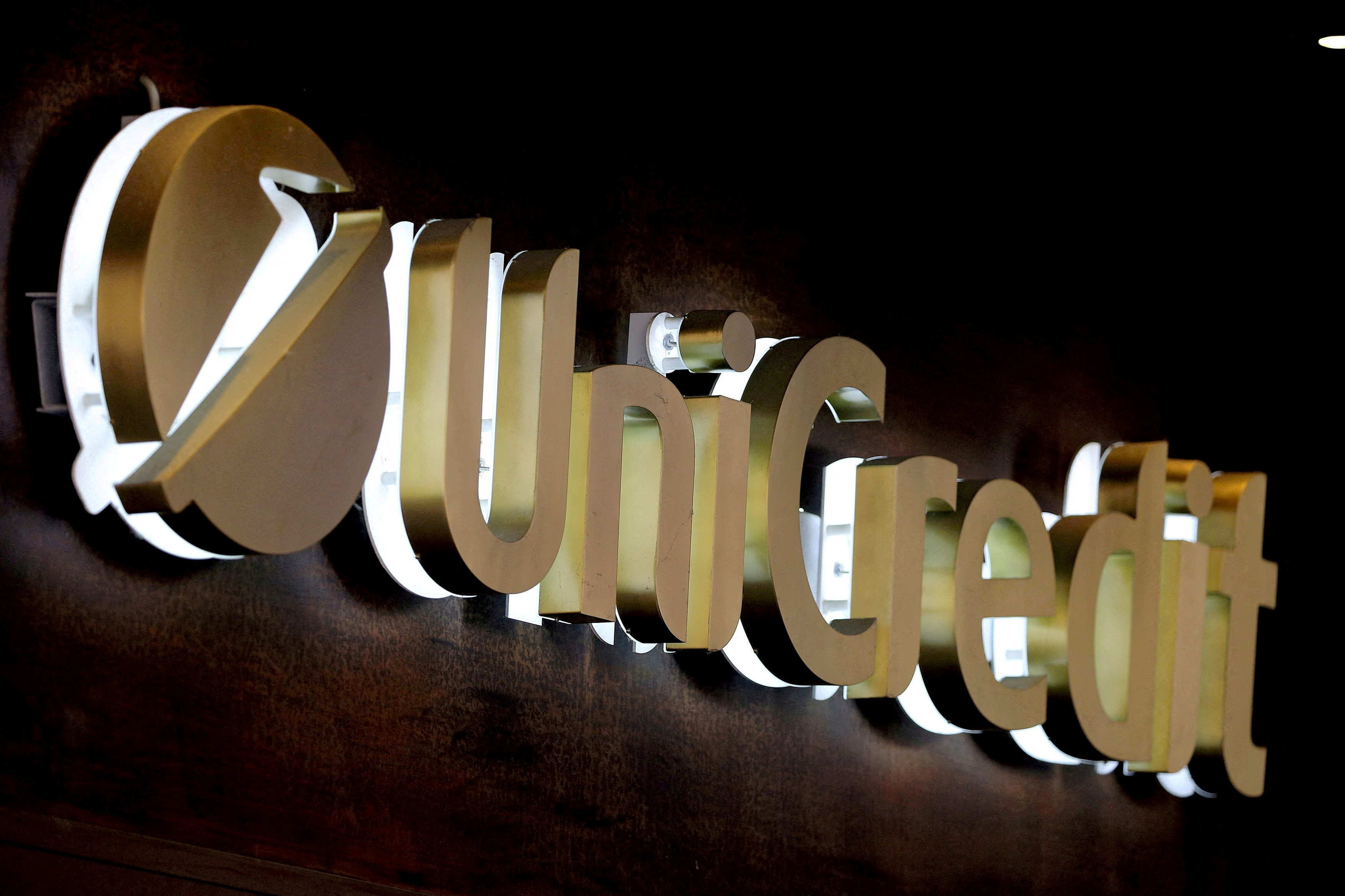 The UniCredit bank logo in the old city centre of Siena, Italy