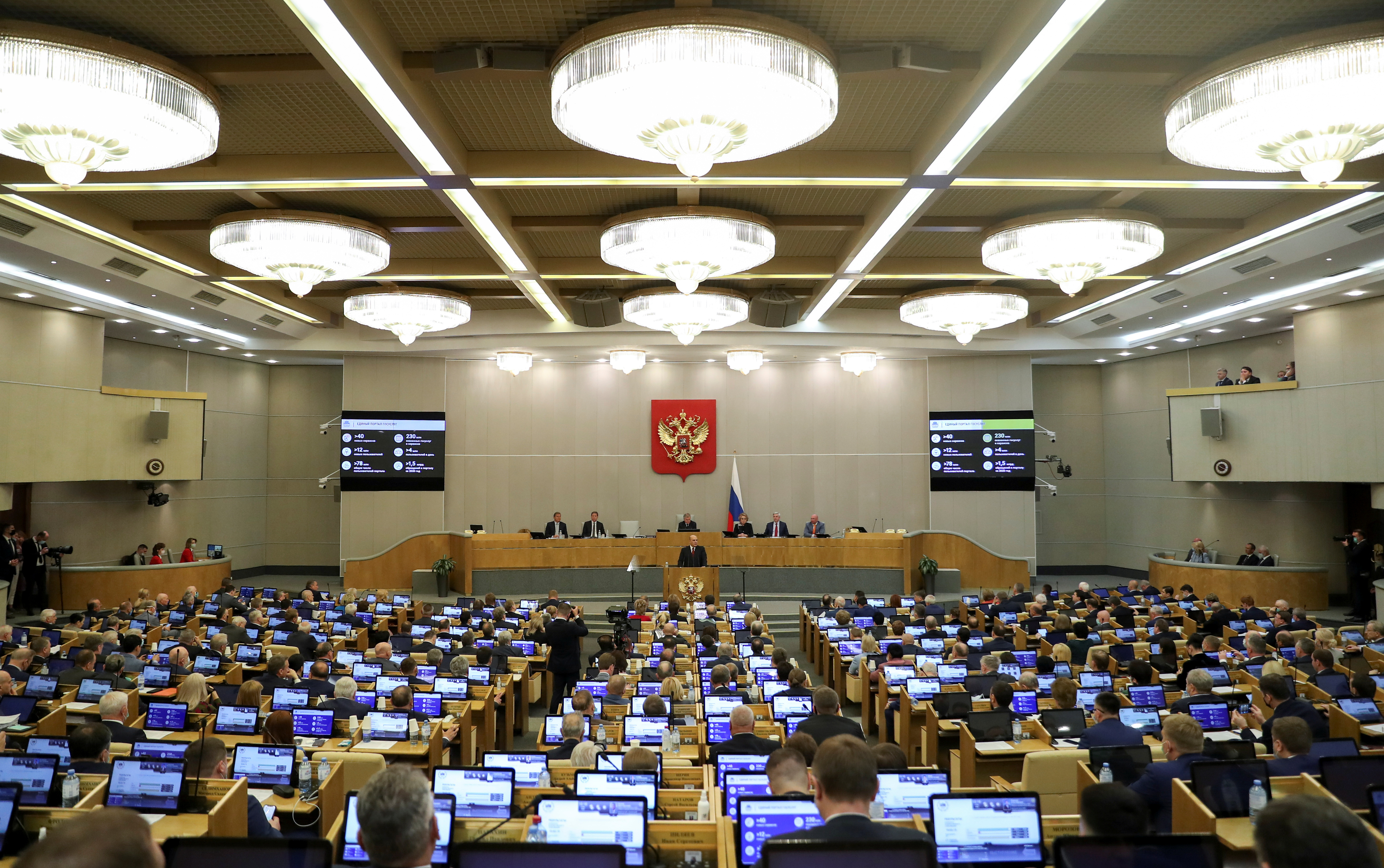 Russian parliamentarians attend a session of the State Duma