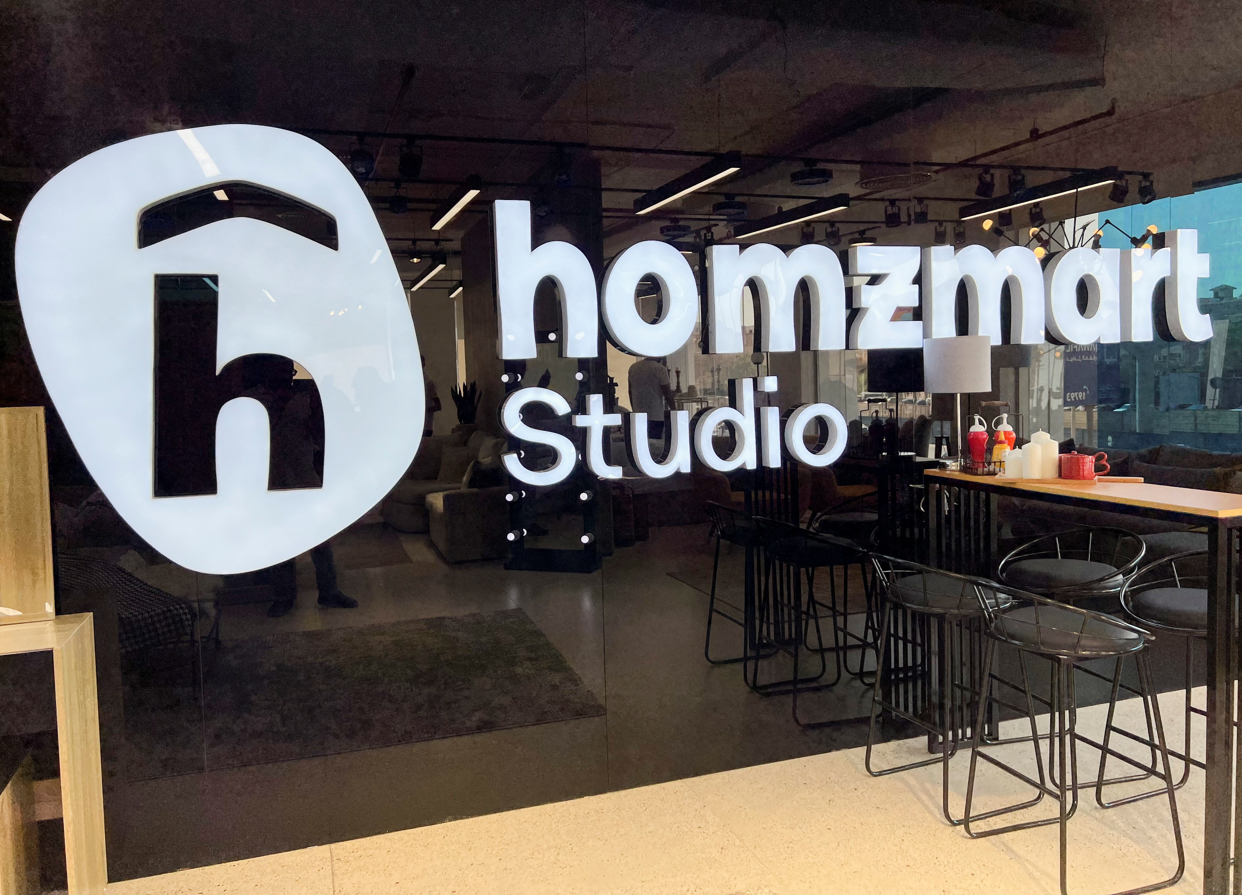 A Homzmart logo is pictured inside a company's showroom in Cairo