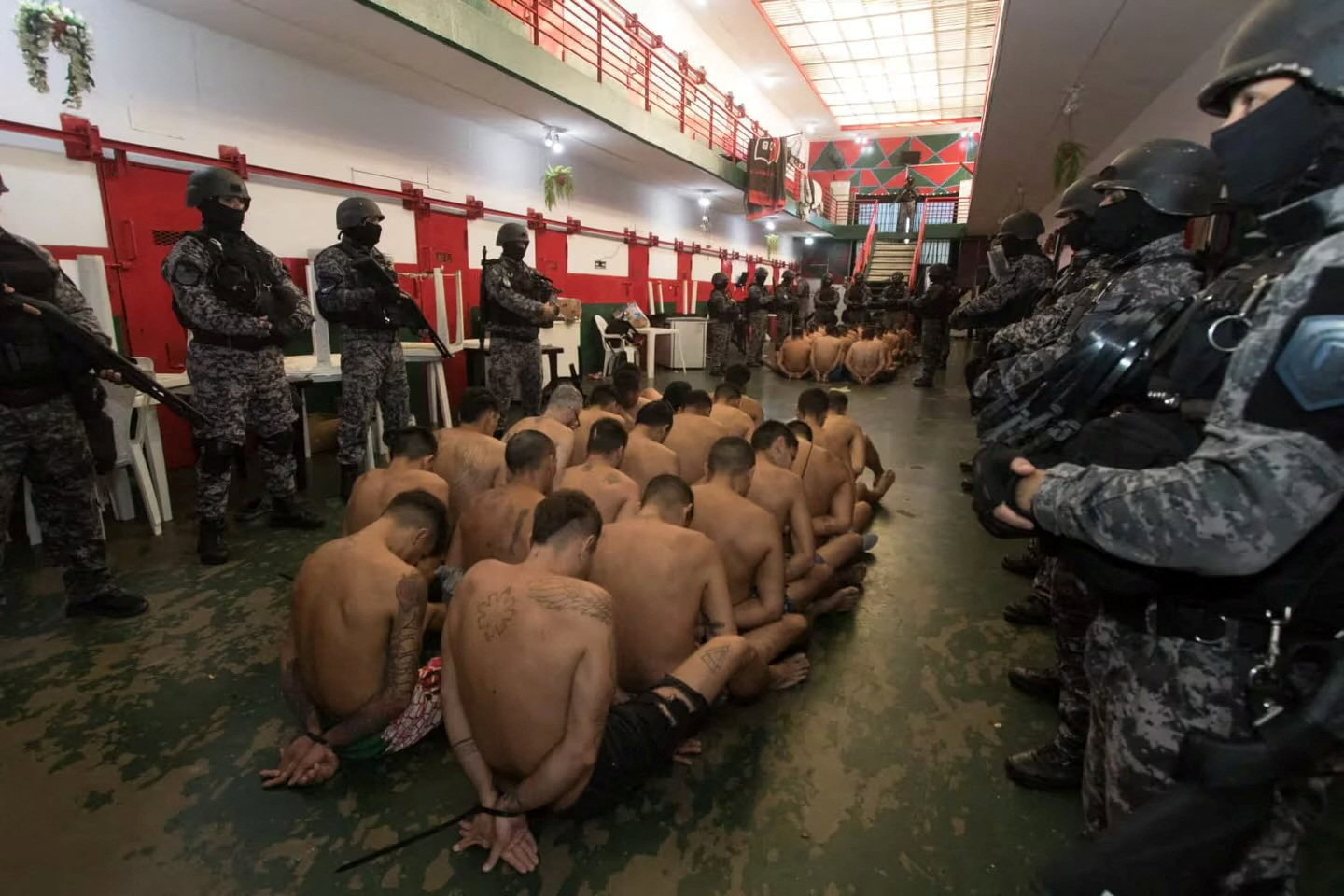 Argentina photo of half naked, bowed prisoners shows tough-on-crime shift |  Reuters