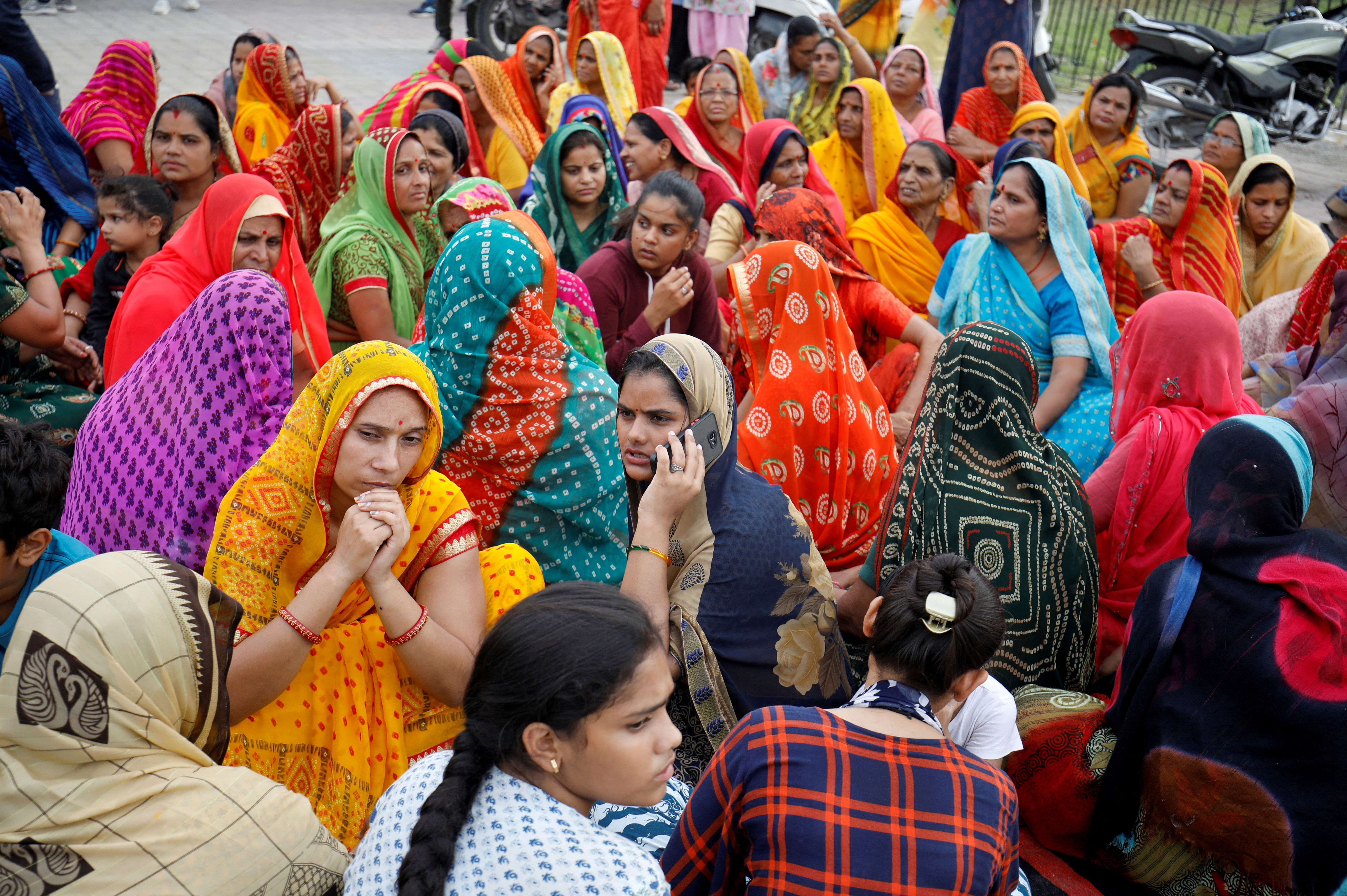 Women attend a prayers meet for Kanhaiyalal Teli, a Hindu tailor, in Udaipur