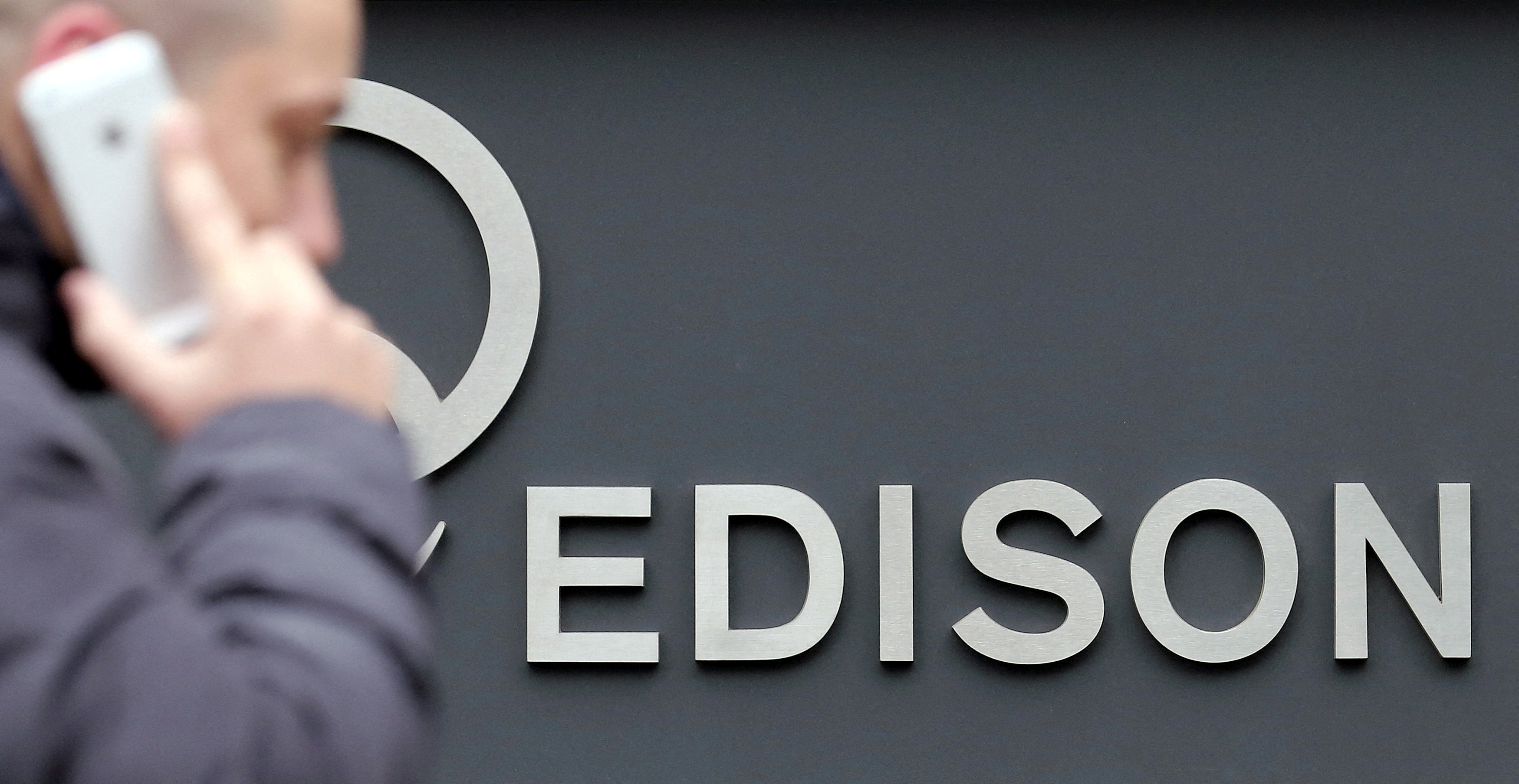 Edison's logo is seen outside the company headquarters in downtown Milan