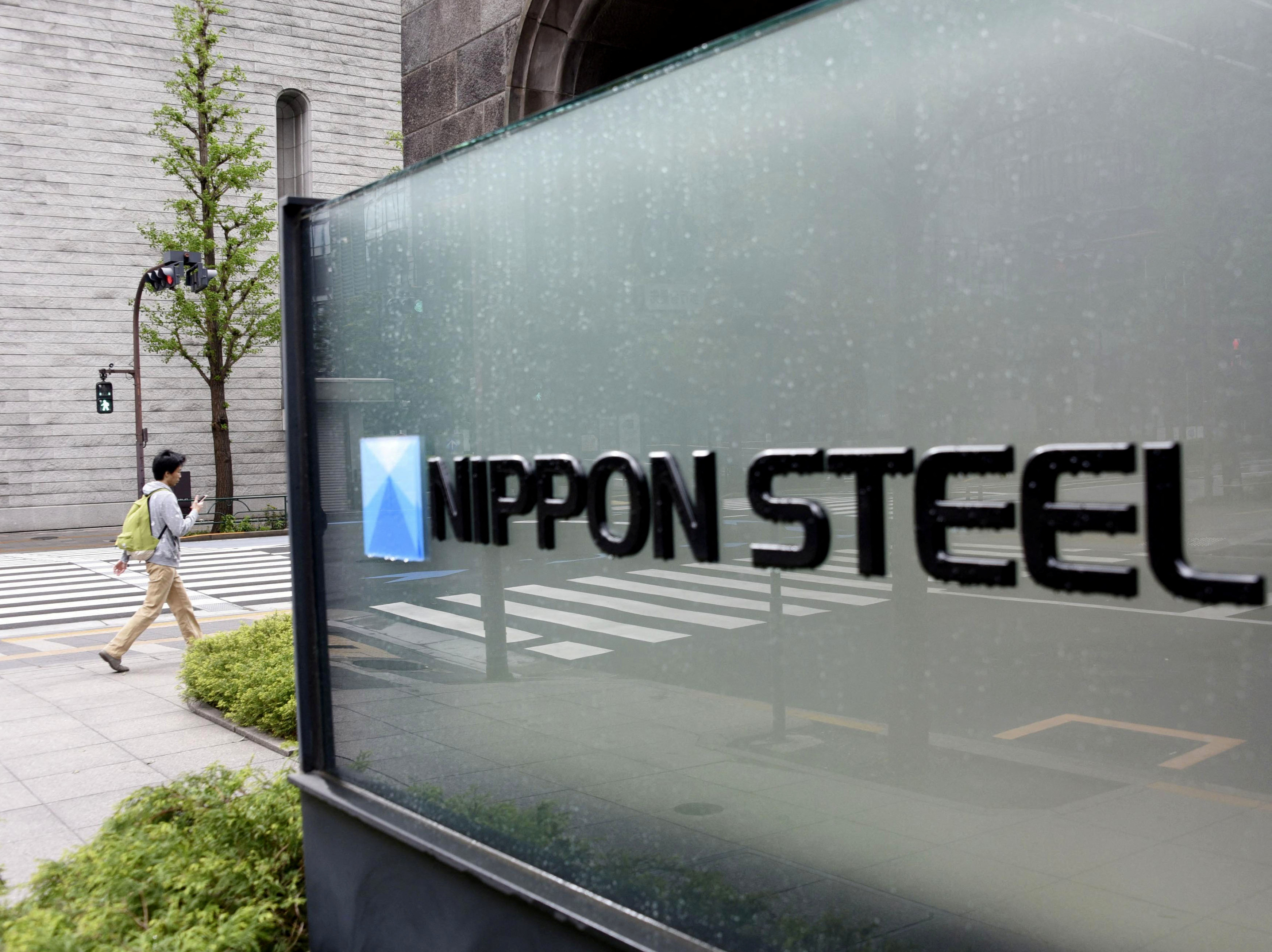 The logo of Nippon Steel Corporation is displayed at the company headquarters in Tokyo