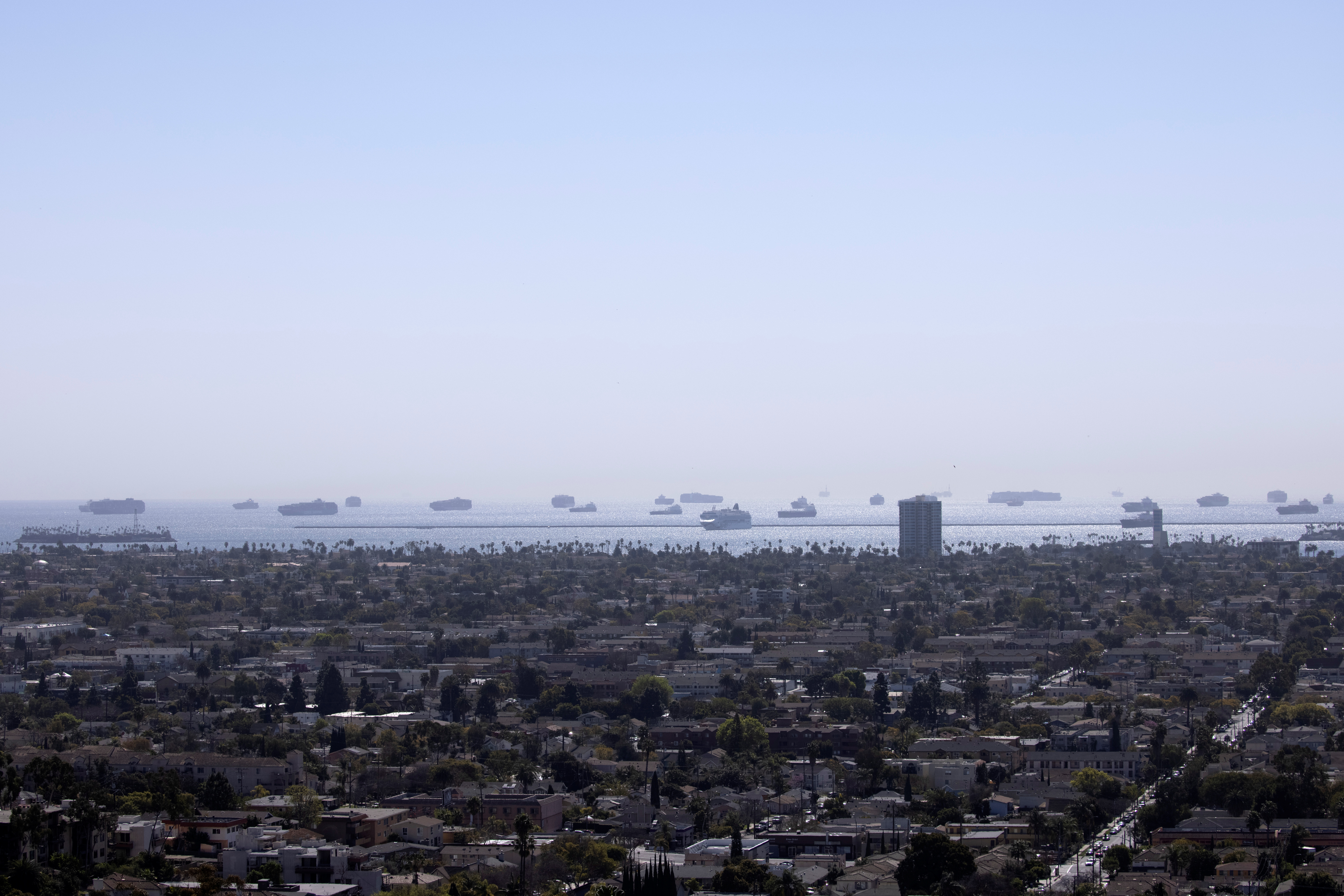 Dozens of container ships sit off the coast of Long Beach waiting to unload their cargo at the Port of Los Angeles in California
