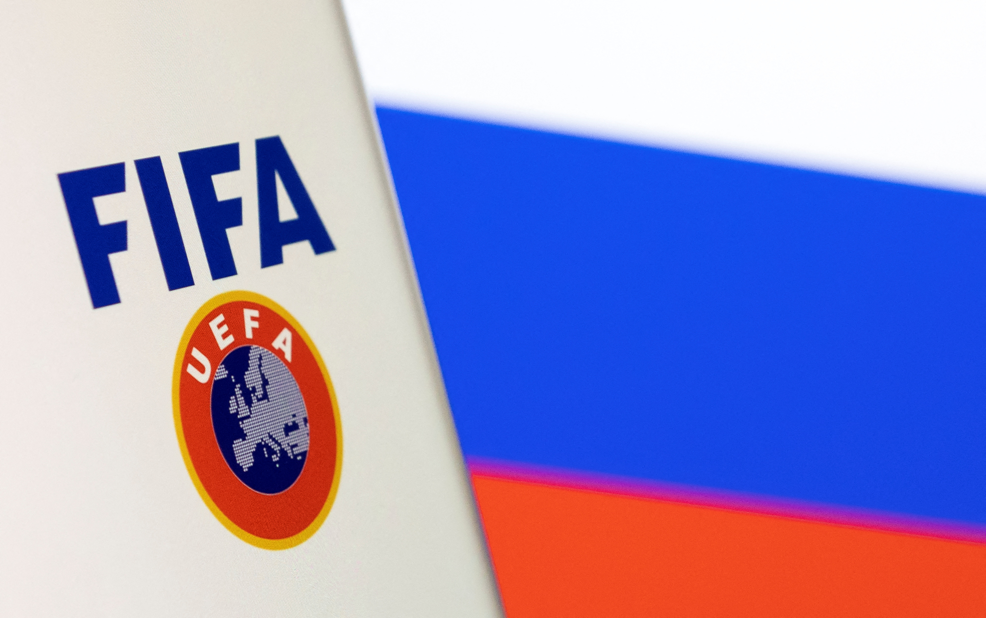 Illustration shows FIFA and UEFA logos and Russian flag
