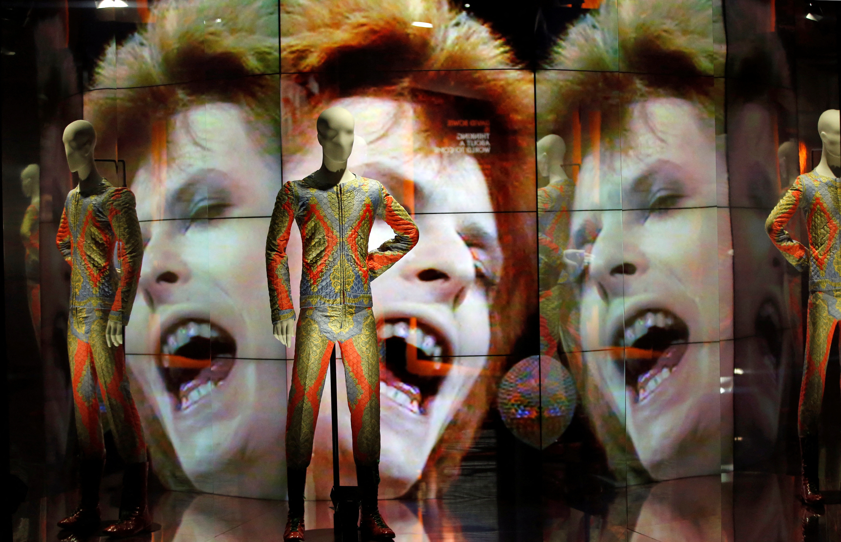 Two suits designed by Freddie Burretti for the Ziggy Stardust tour are displayed during the exhibition "David Bowie Is" at the Paris Philharmonic Hall "Philharmonie de Paris\