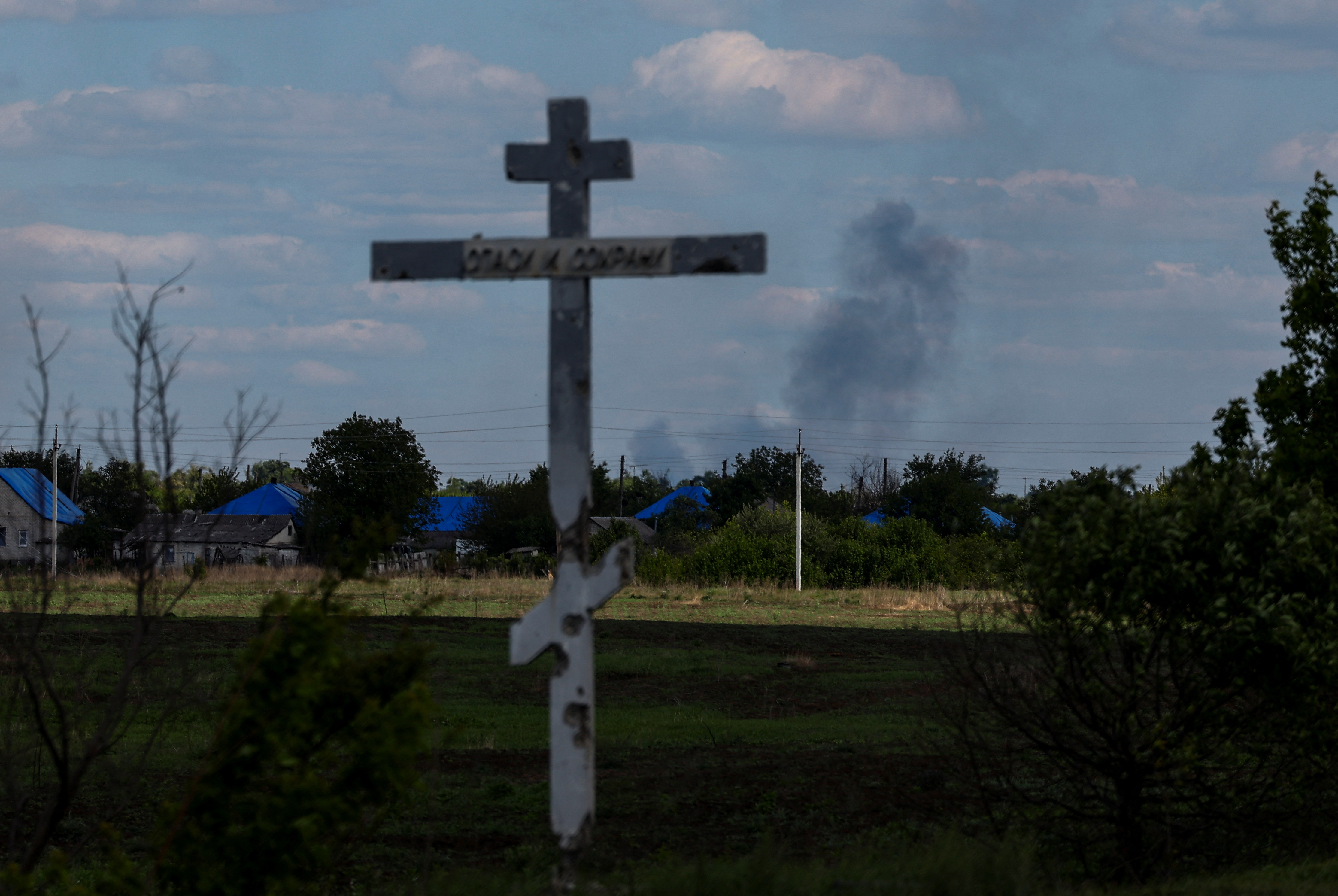 Smoke rises after a Russian military strike in the town of Lyman