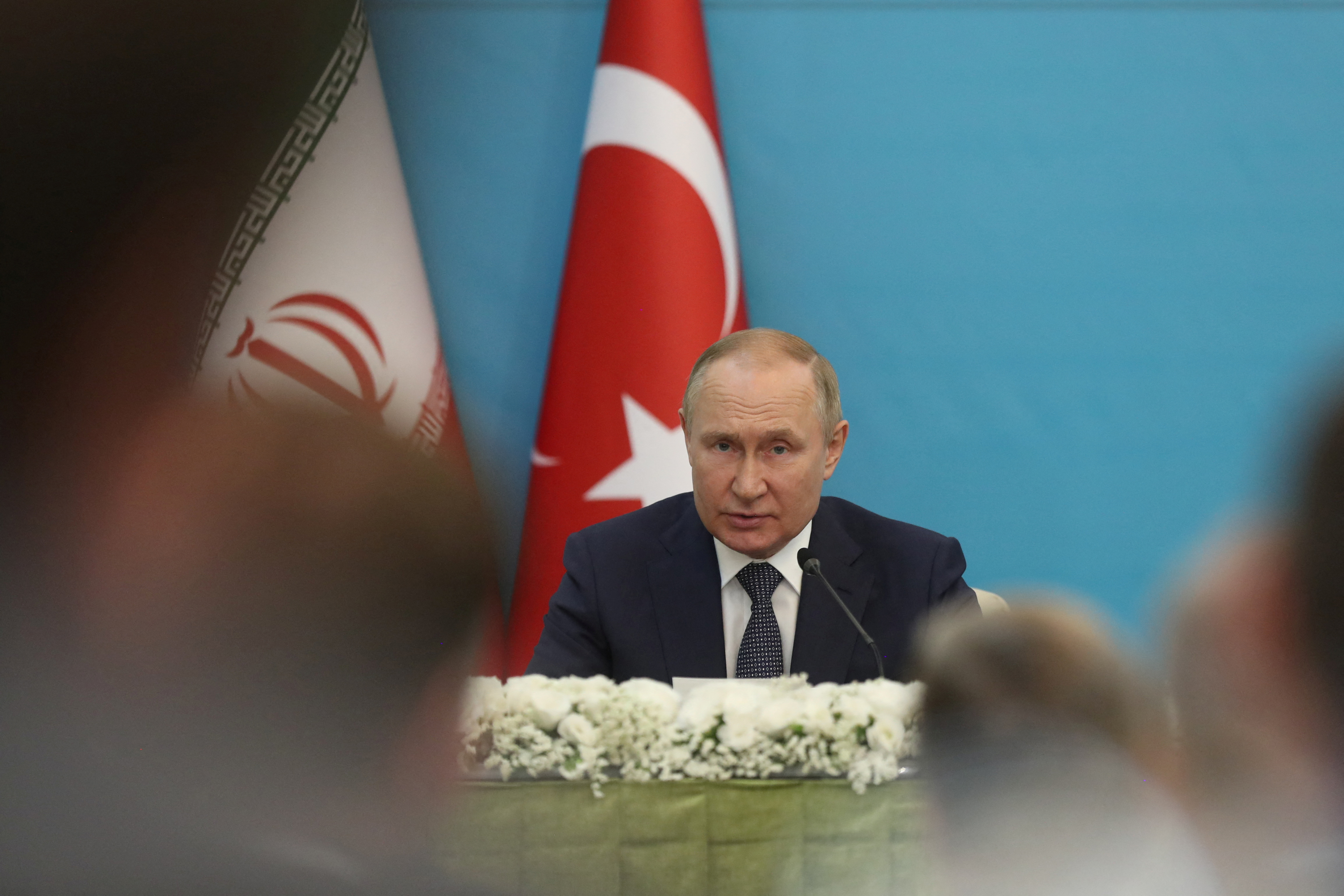 Russian President Vladimir Putin attends a news conference following the Astana Process summit in Tehran