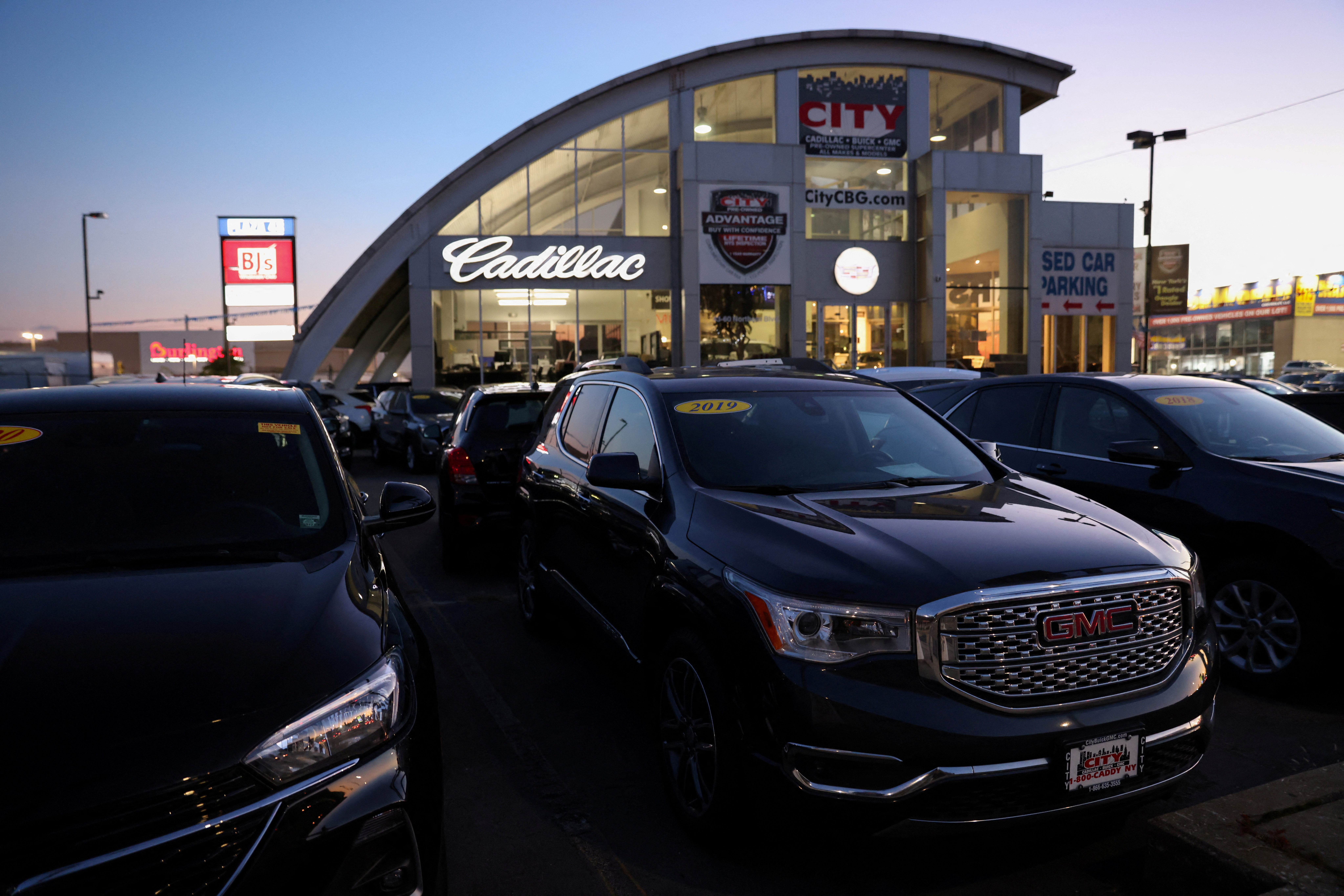 Vehicles of automobile brands belonging to General Motors Company are seen at a car dealership in Queens, New York