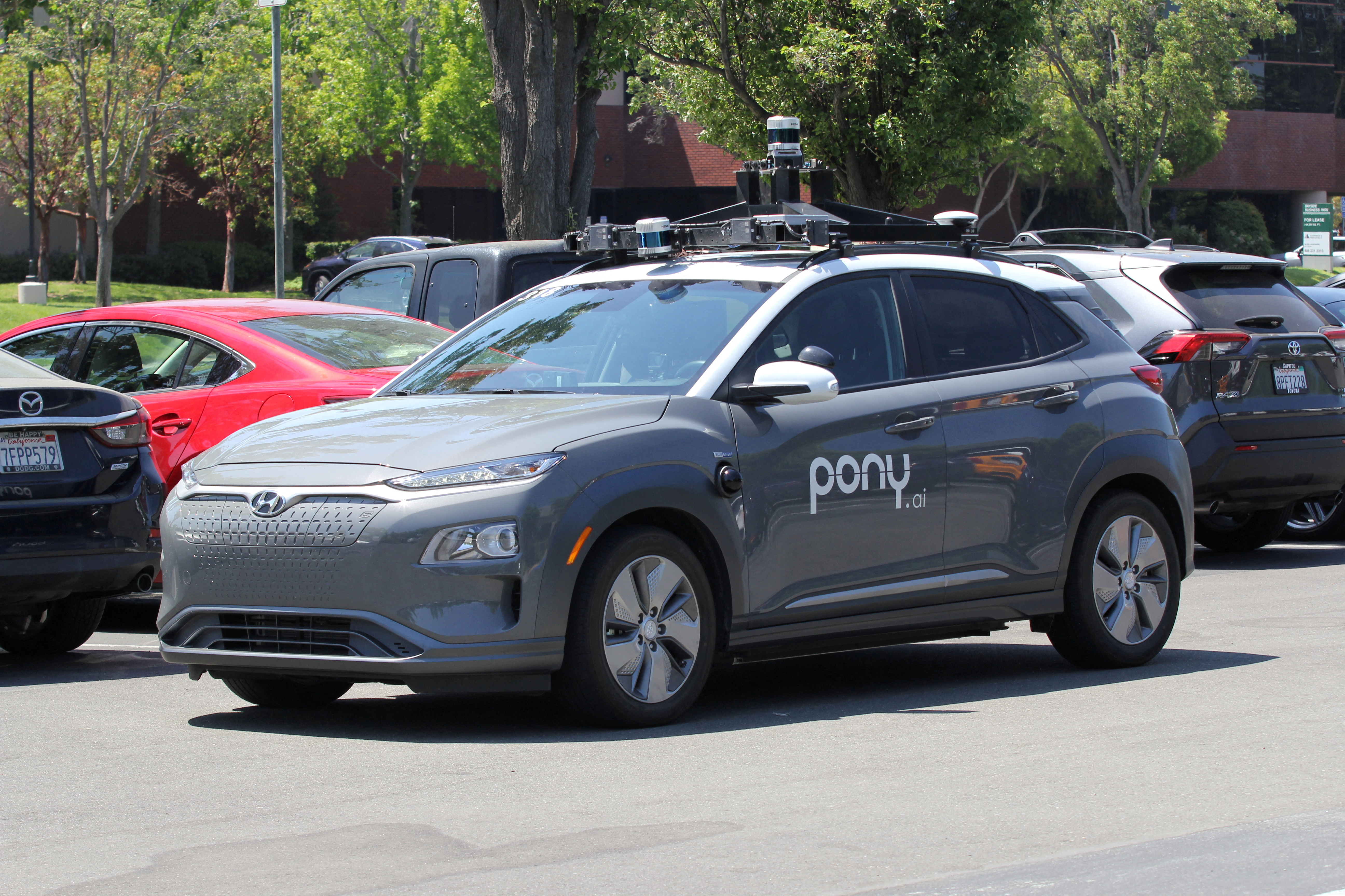 A vehicle equipped with Pony.ai's self-driving technology is parked at the company's office in Fremont