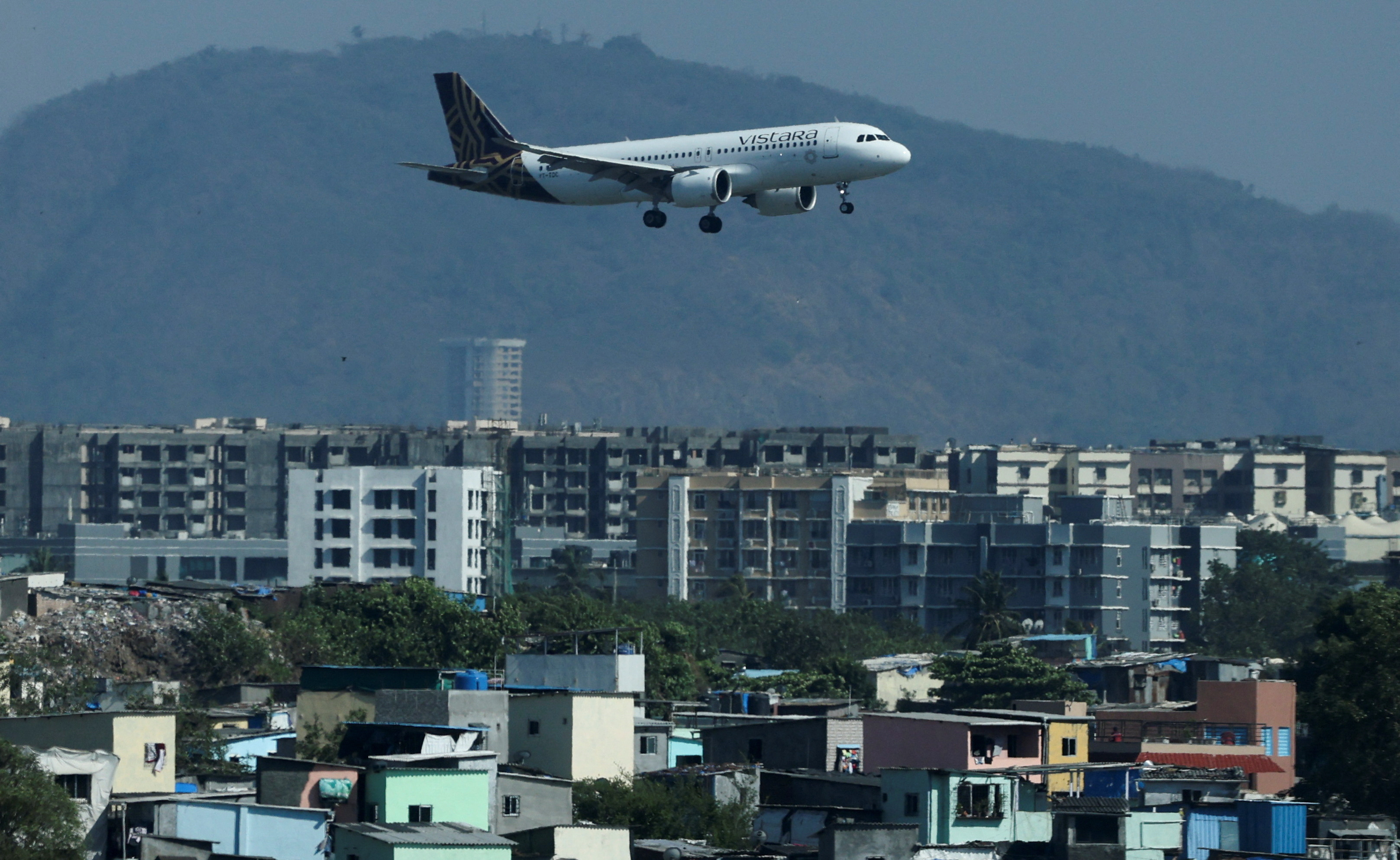 A Vistara passenger aircraft lands at the Chhatrapati Shivaji International airport in Mumbai